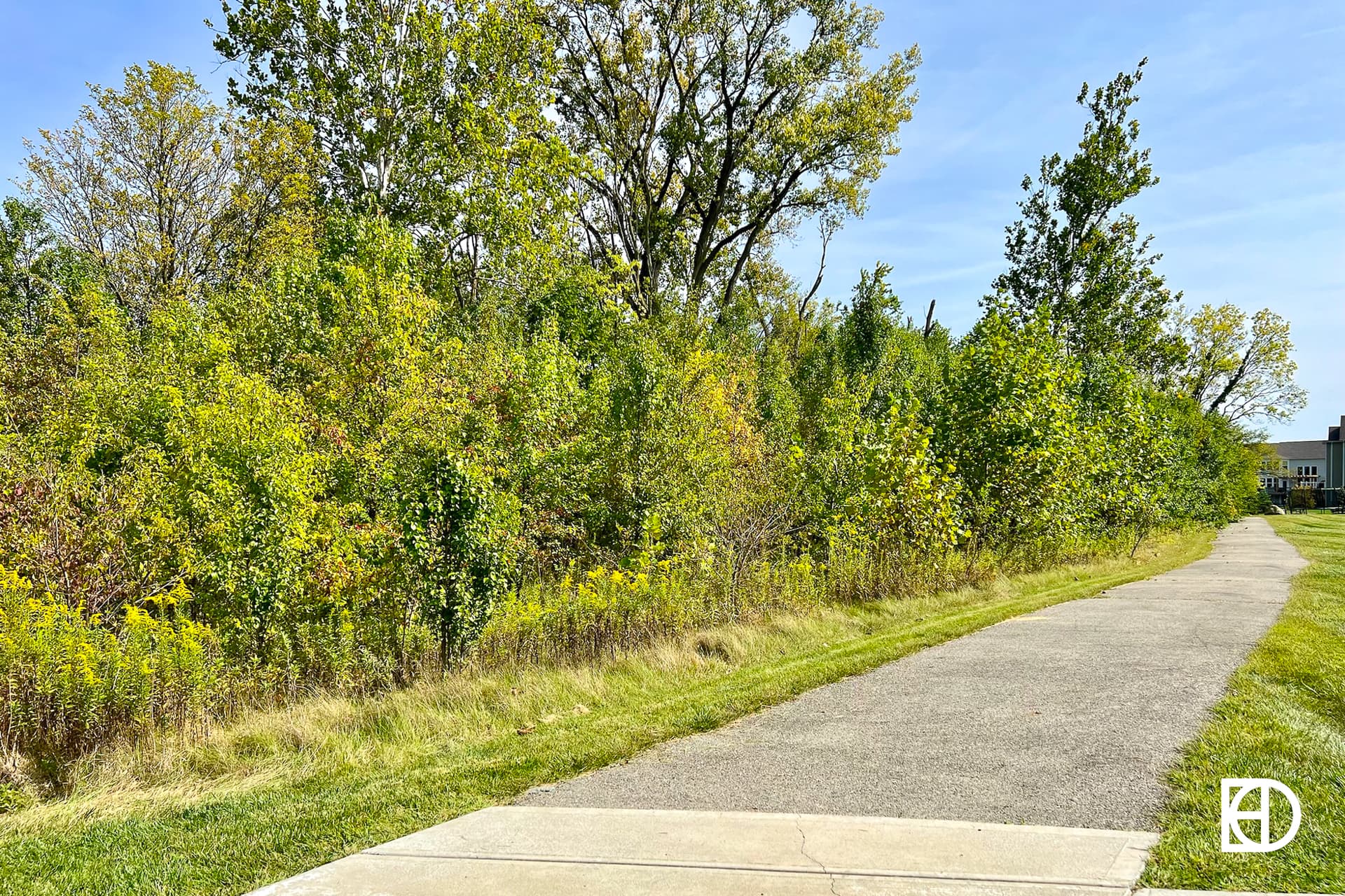 Exterior photo of Bear Creek, showing landscaping and walking paths