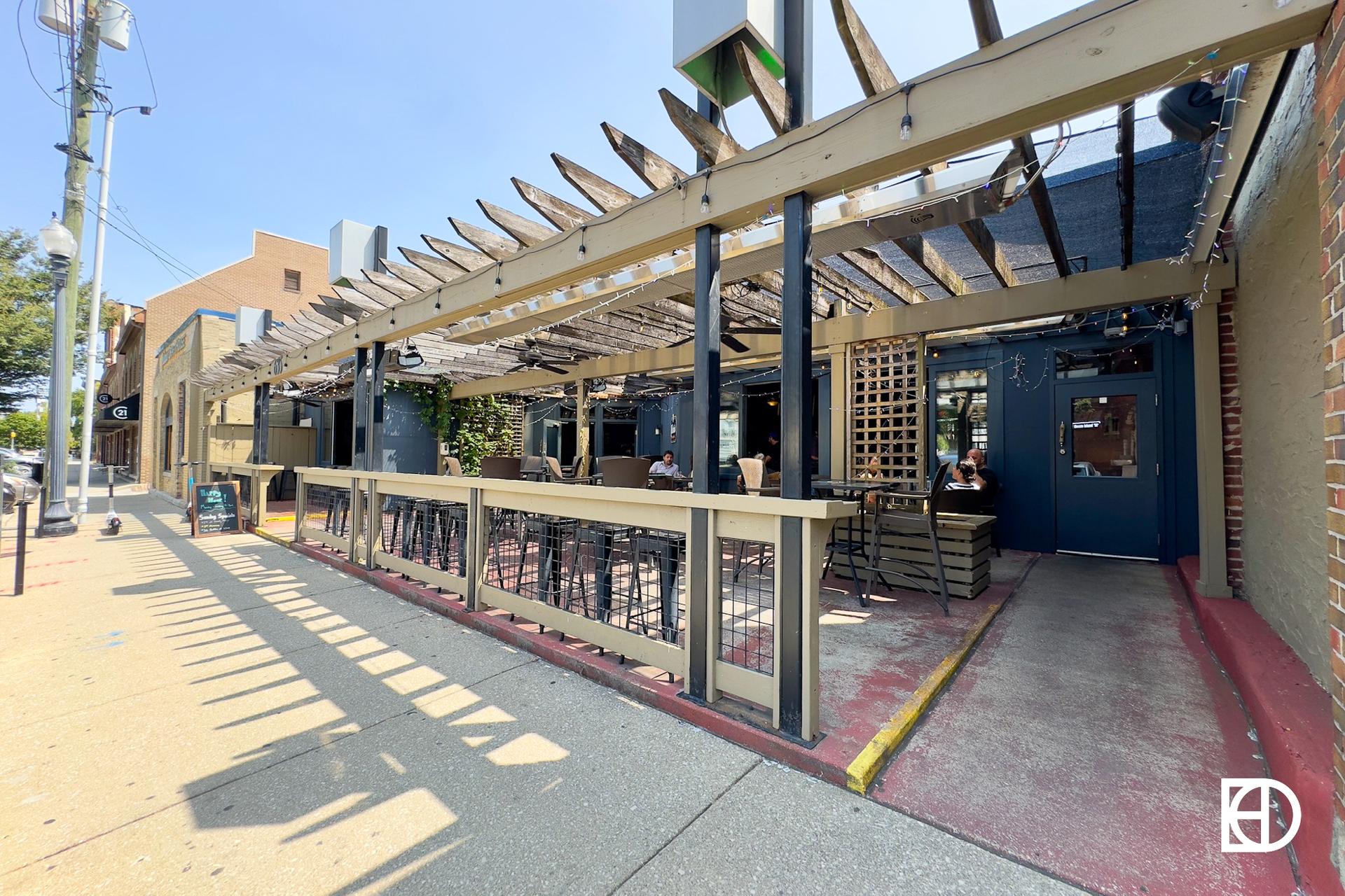 Exterior photo of Ralston's Drafthouse, showing patio and entrance