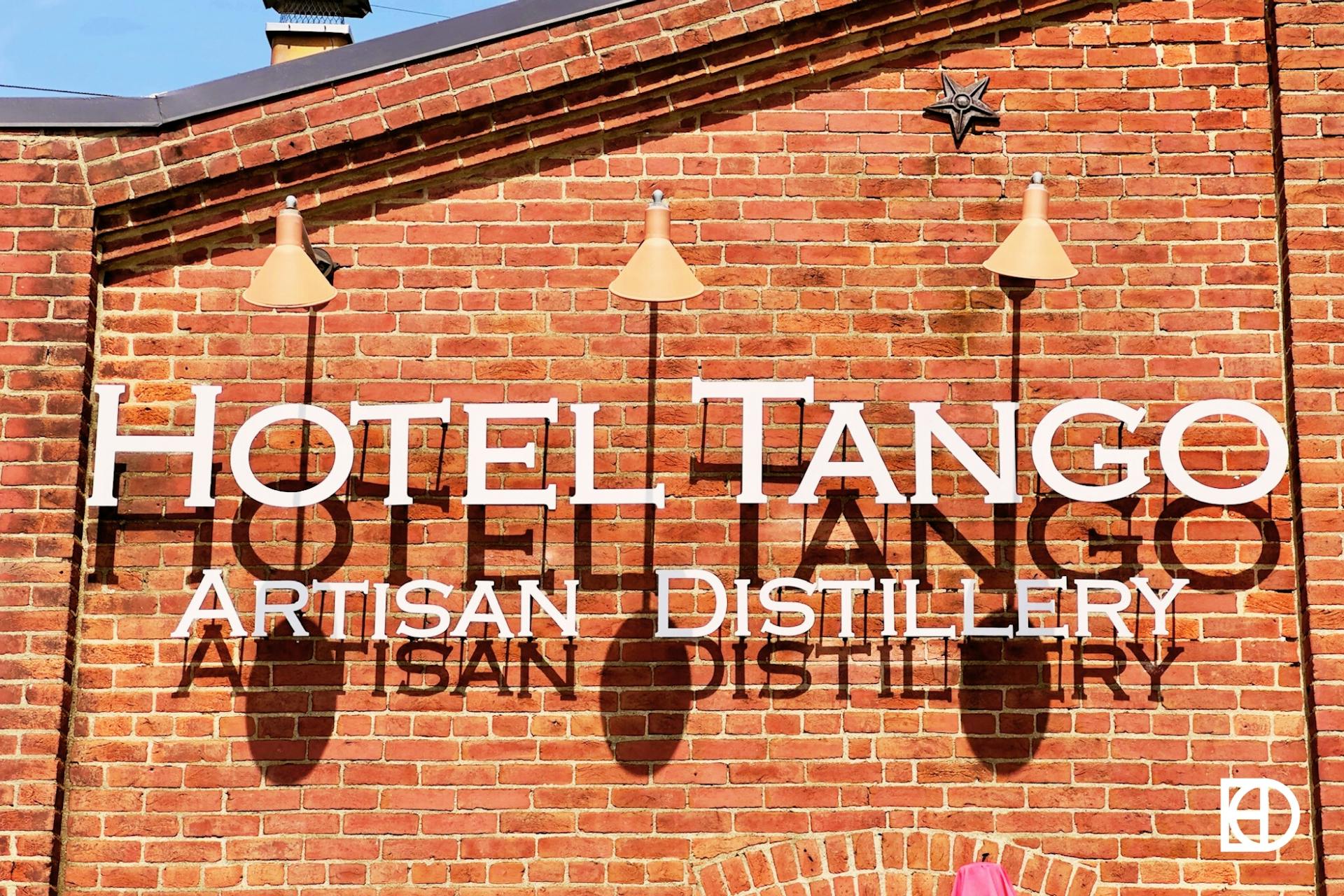 Exterior photo of Hotel Tango Distillery, showing signage