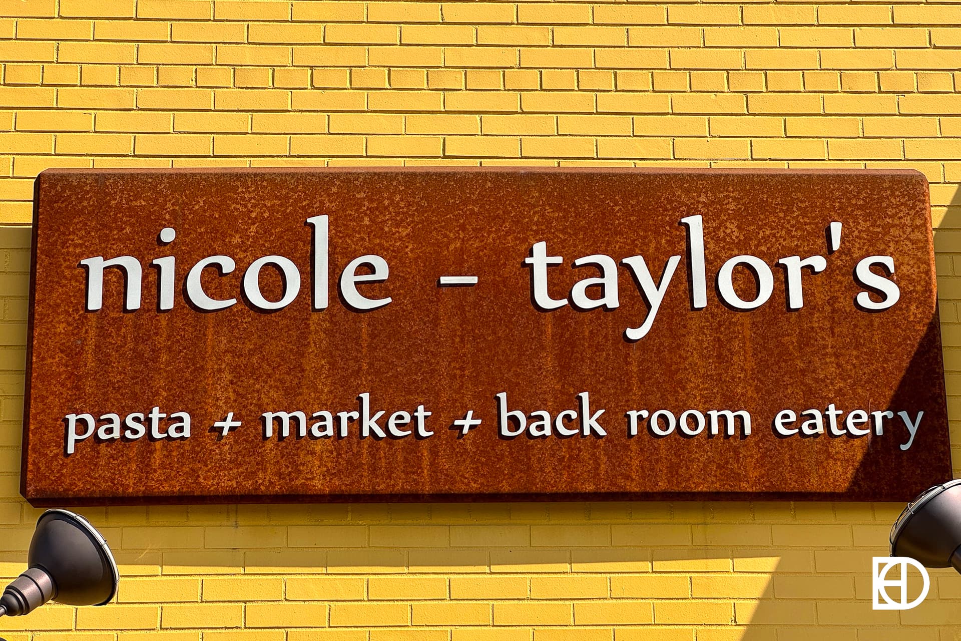 Exterior photo of Nicole Taylor's, showing signage