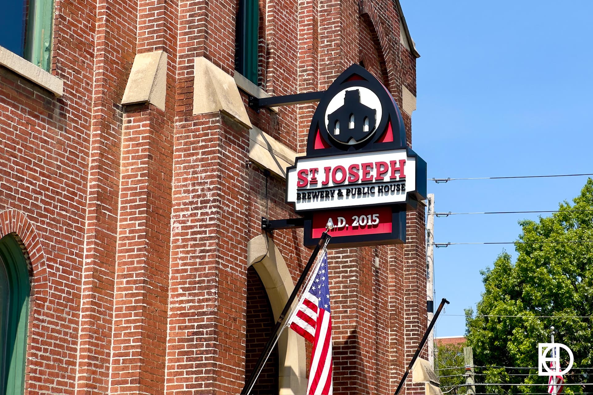 Exterior photo of St. Joseph Brewery, showing signage and entrance