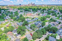 Aerial photo of downtown Indianapolis neighborhood with skyline in the background