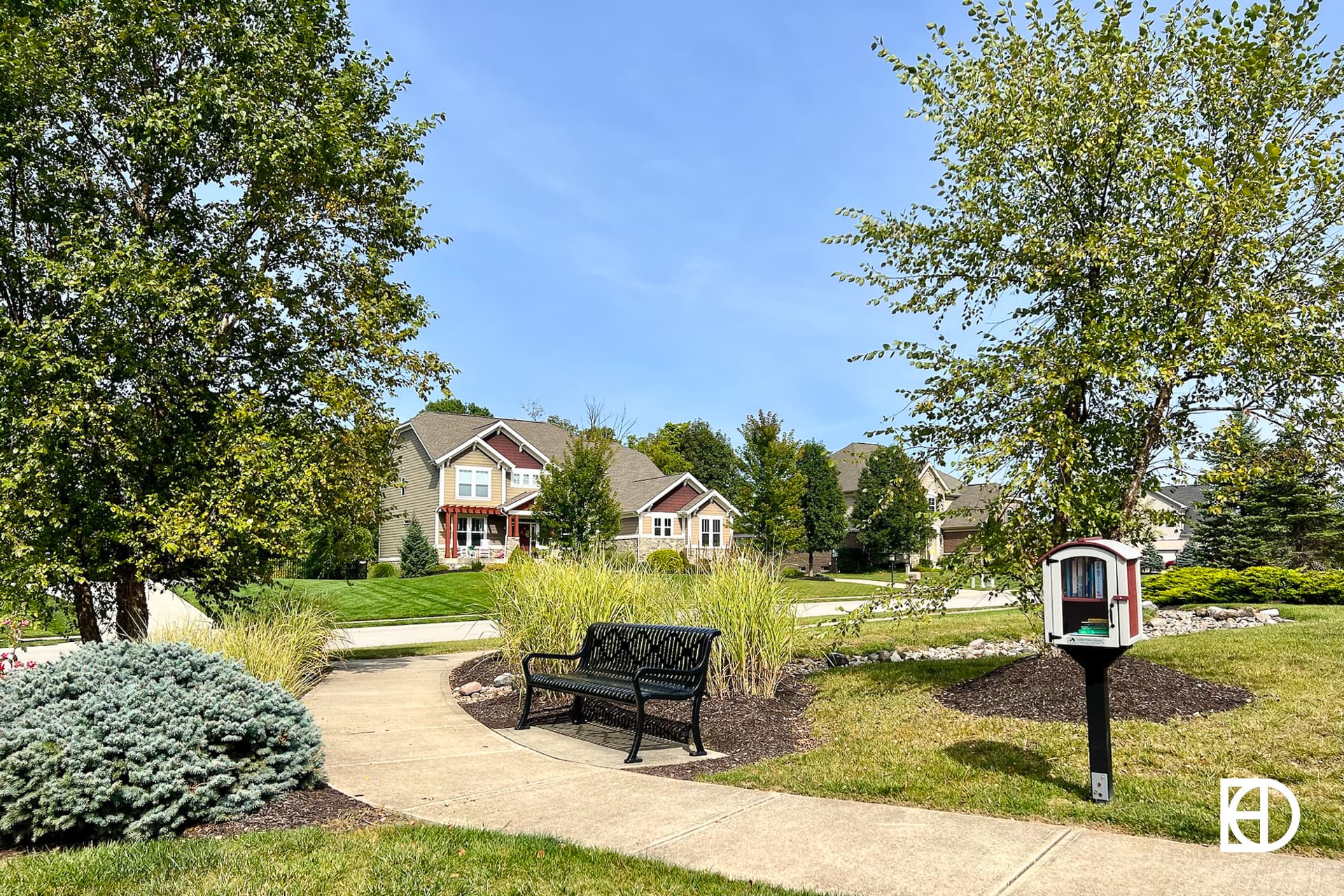 Exterior photo of Overbrook Farms, showing walking path and landscaping