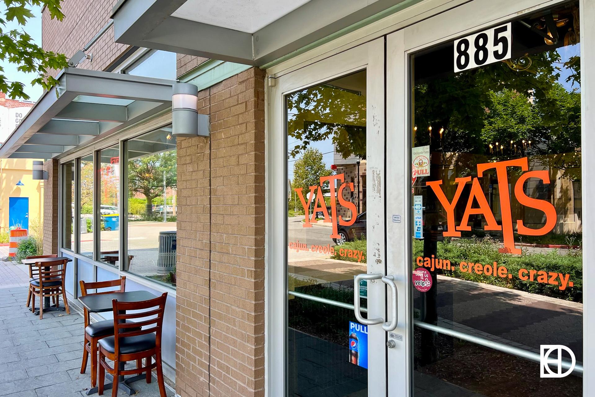 Exterior photo of Yats, showing patio and entrance