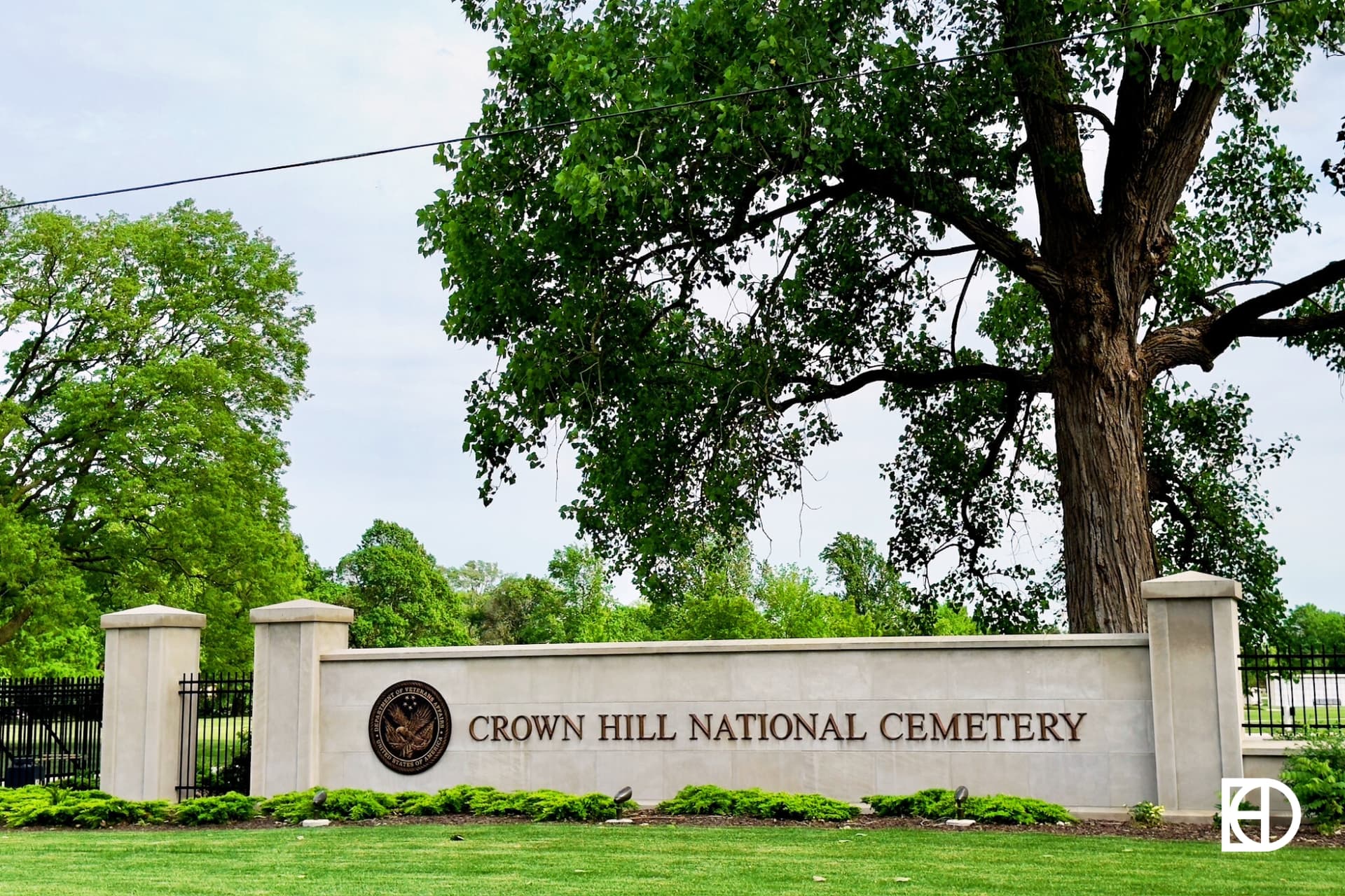 Exterior photo of Crown Hill Cemetery, showing signage