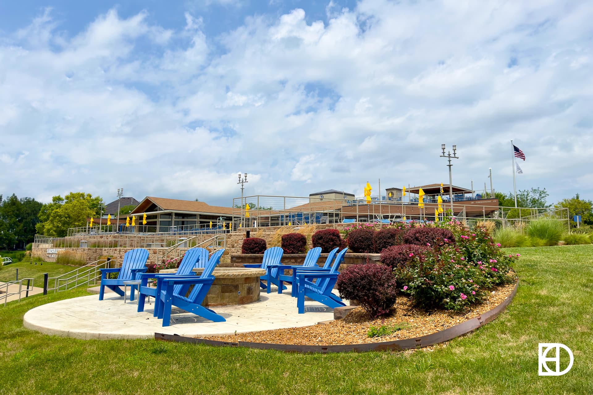 Exterior photo of Harbour Trees Beach Club, showing pool and landscaping