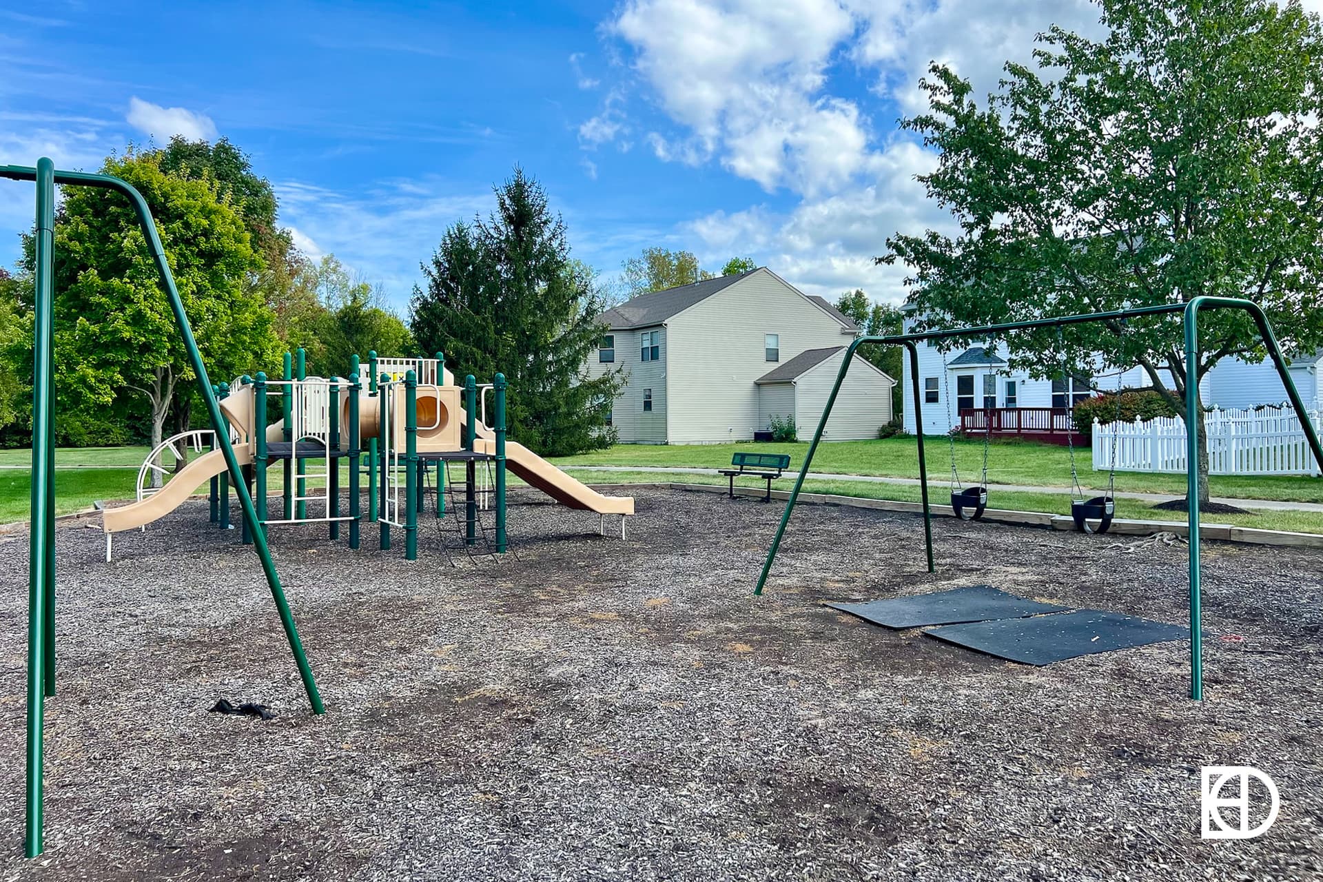 Exterior photo of Brookstone Park, showing playground and homes