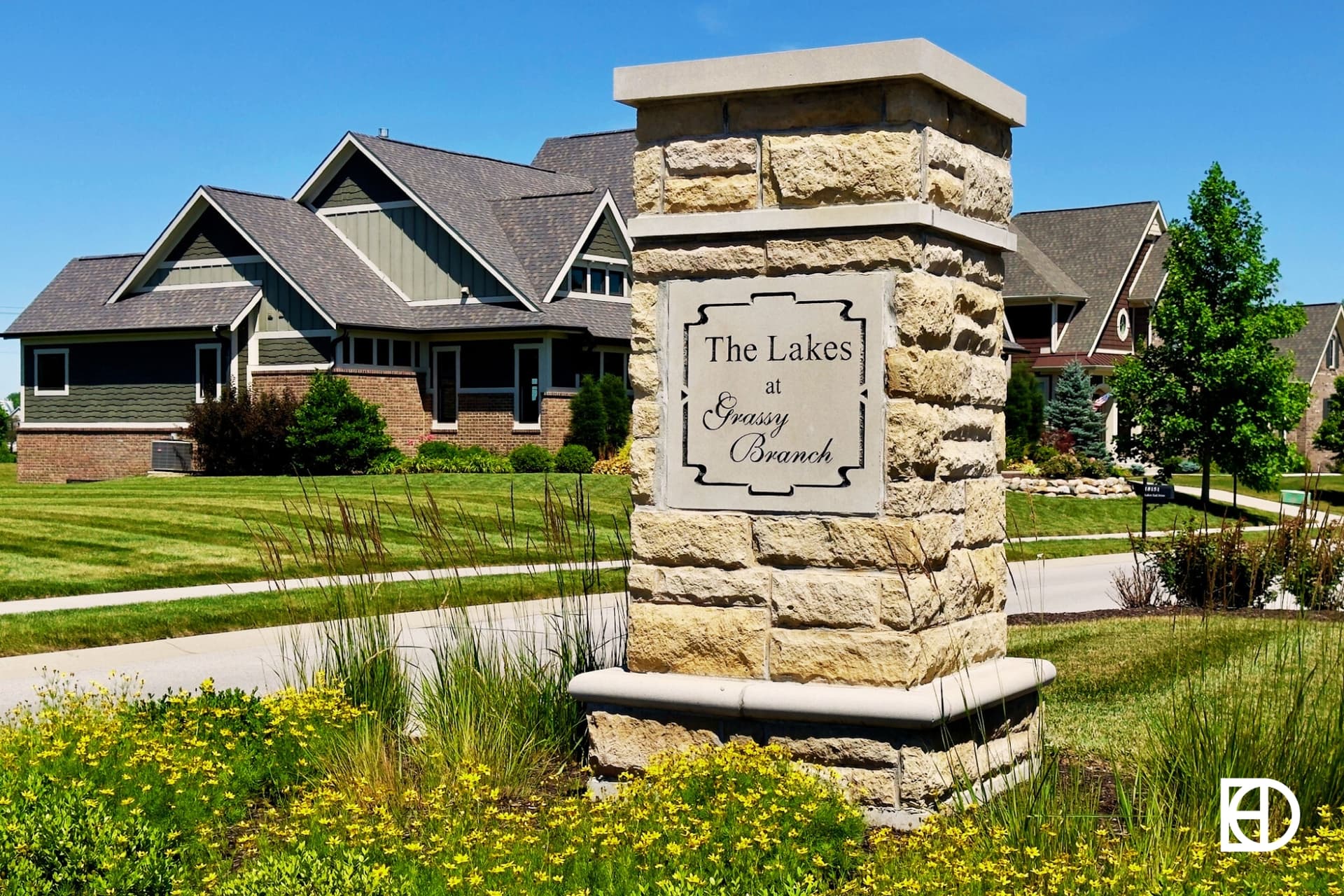 Exterior photo of Lakes at Grassy Branch, showing signage and landscaping