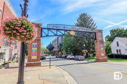 Archway sign over Main Street showcasing entrance to Arts & Design District