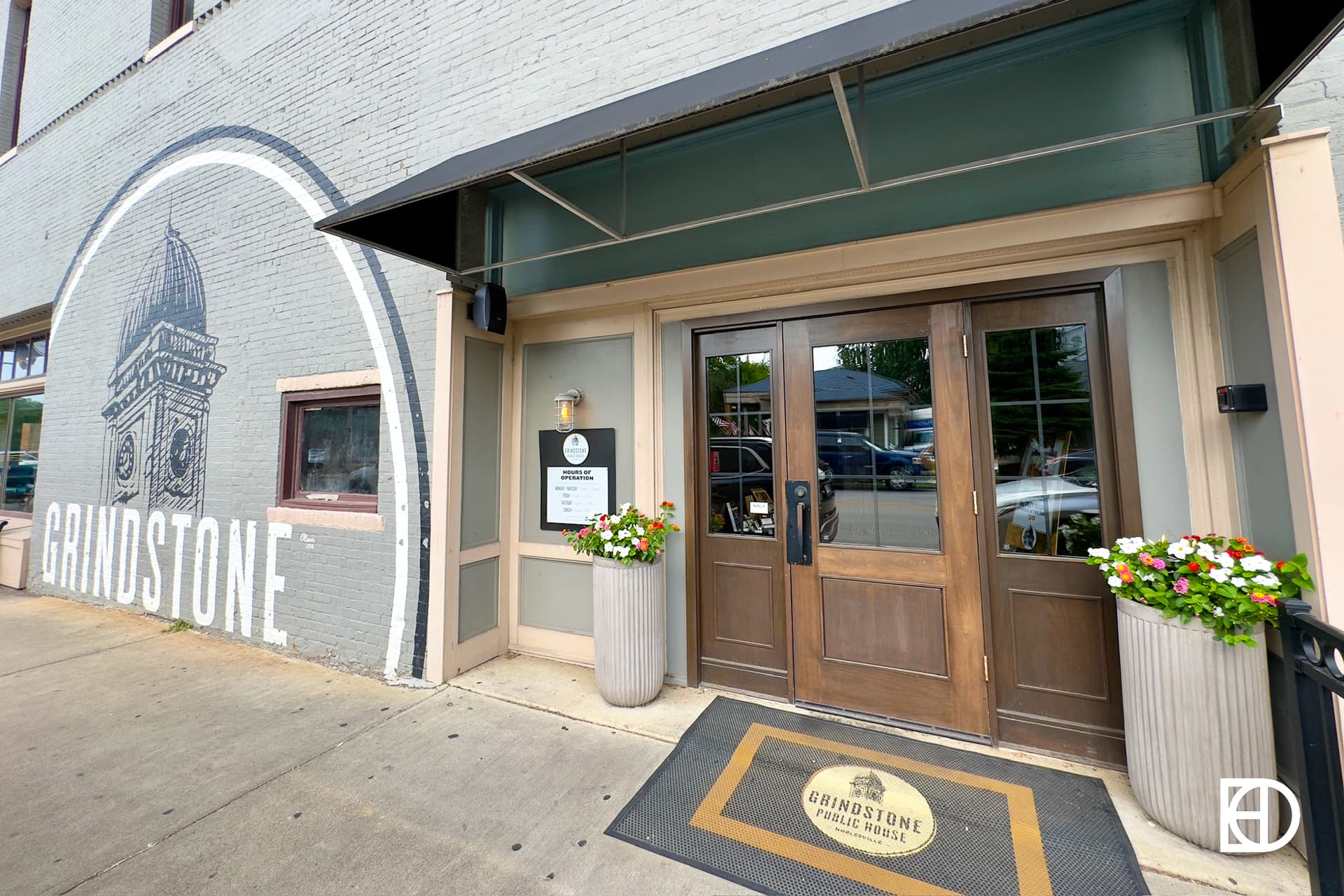 Exterior photo of Grindstone Public House, showing signage and entrance