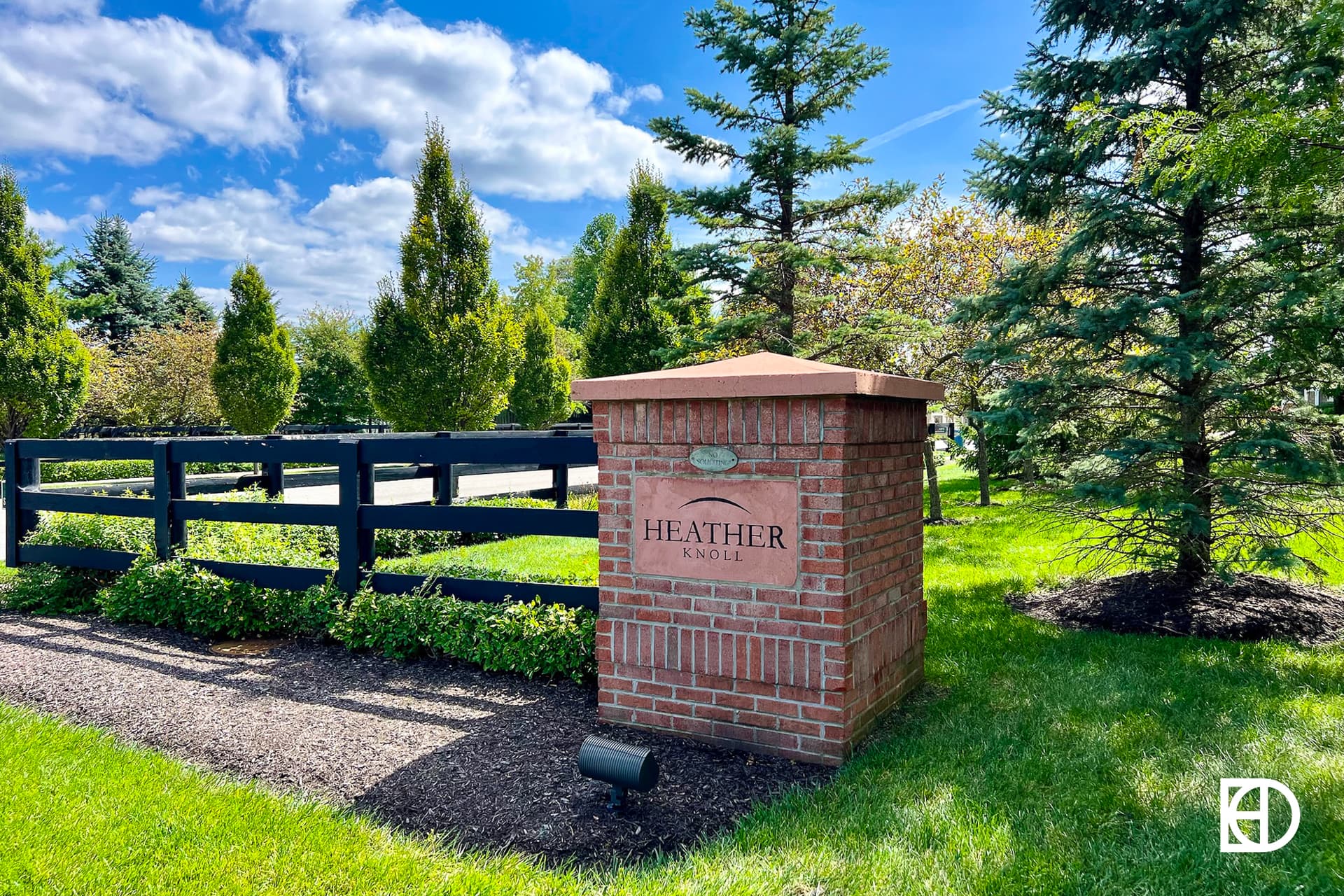 Exterior photo of Heather Knoll, showing signage and landscaping