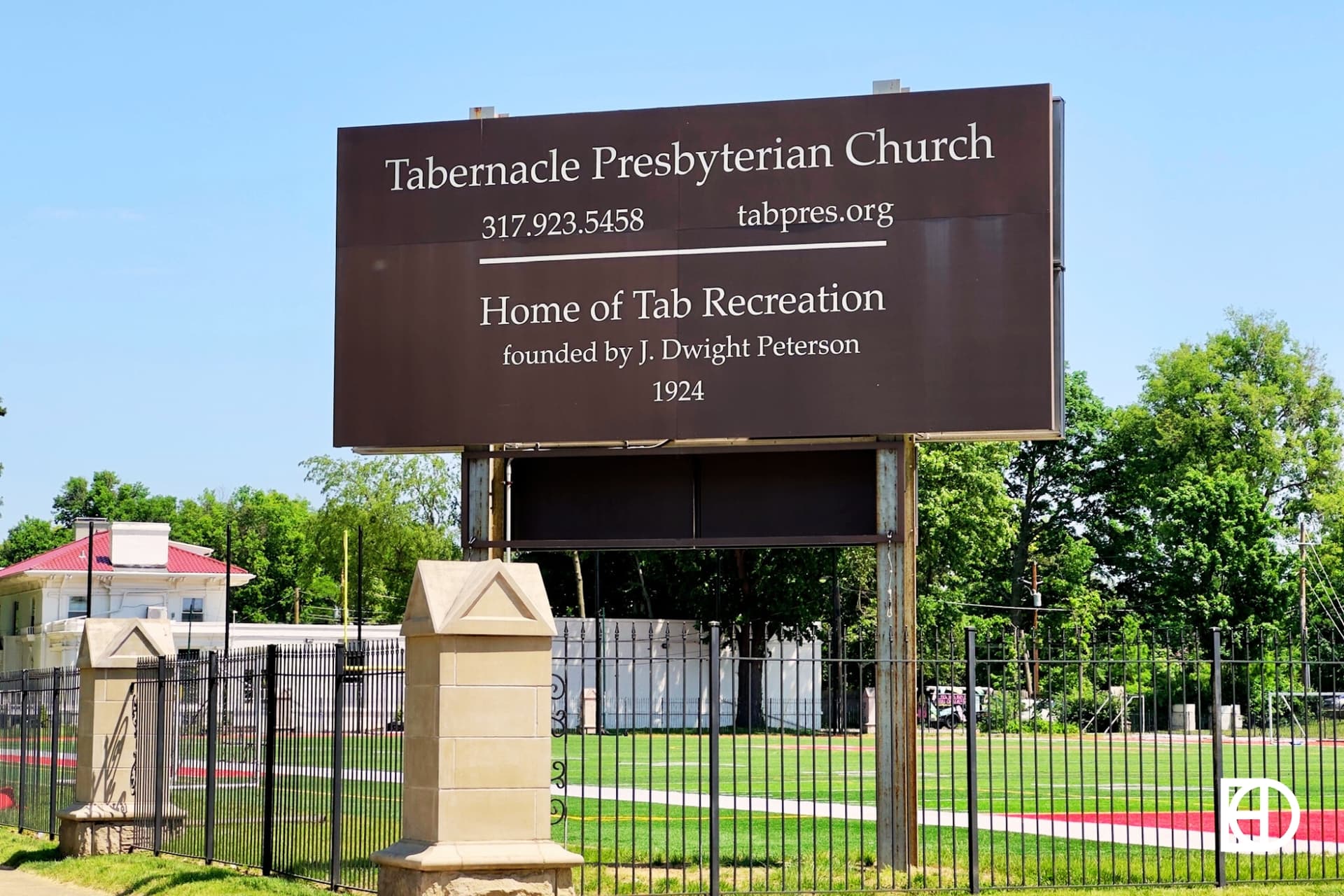 Exterior photo of Tabernacle Church, showing signage