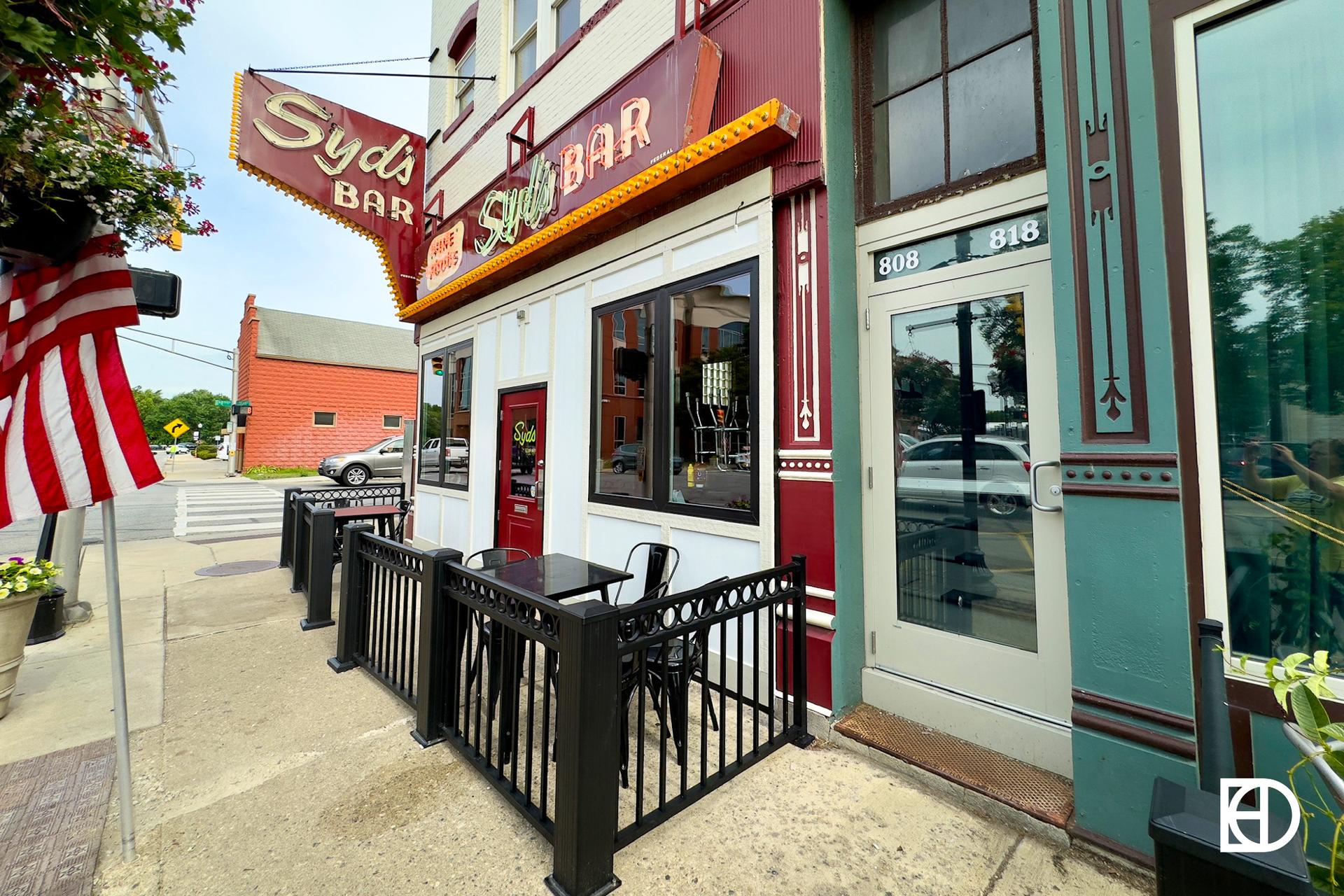 Exterior photo of Syd's, showing signage and entrance