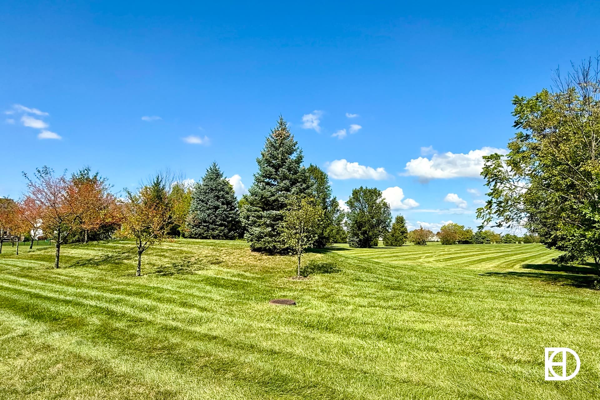 Exterior photo of Ridge at Hayden Run, showing paths and landscaping