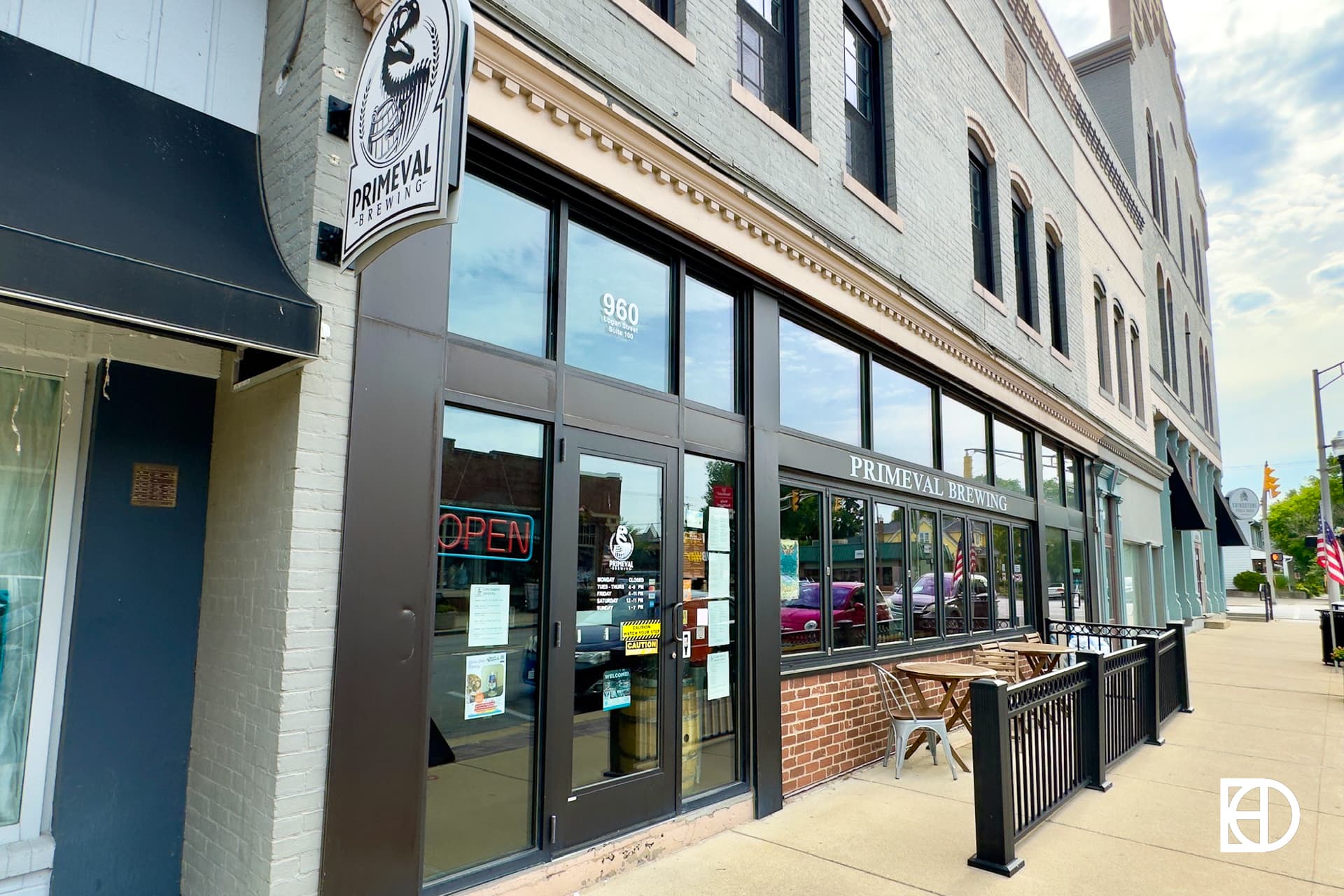 Exterior photo of Primeval Brewing, showing entrance and patio