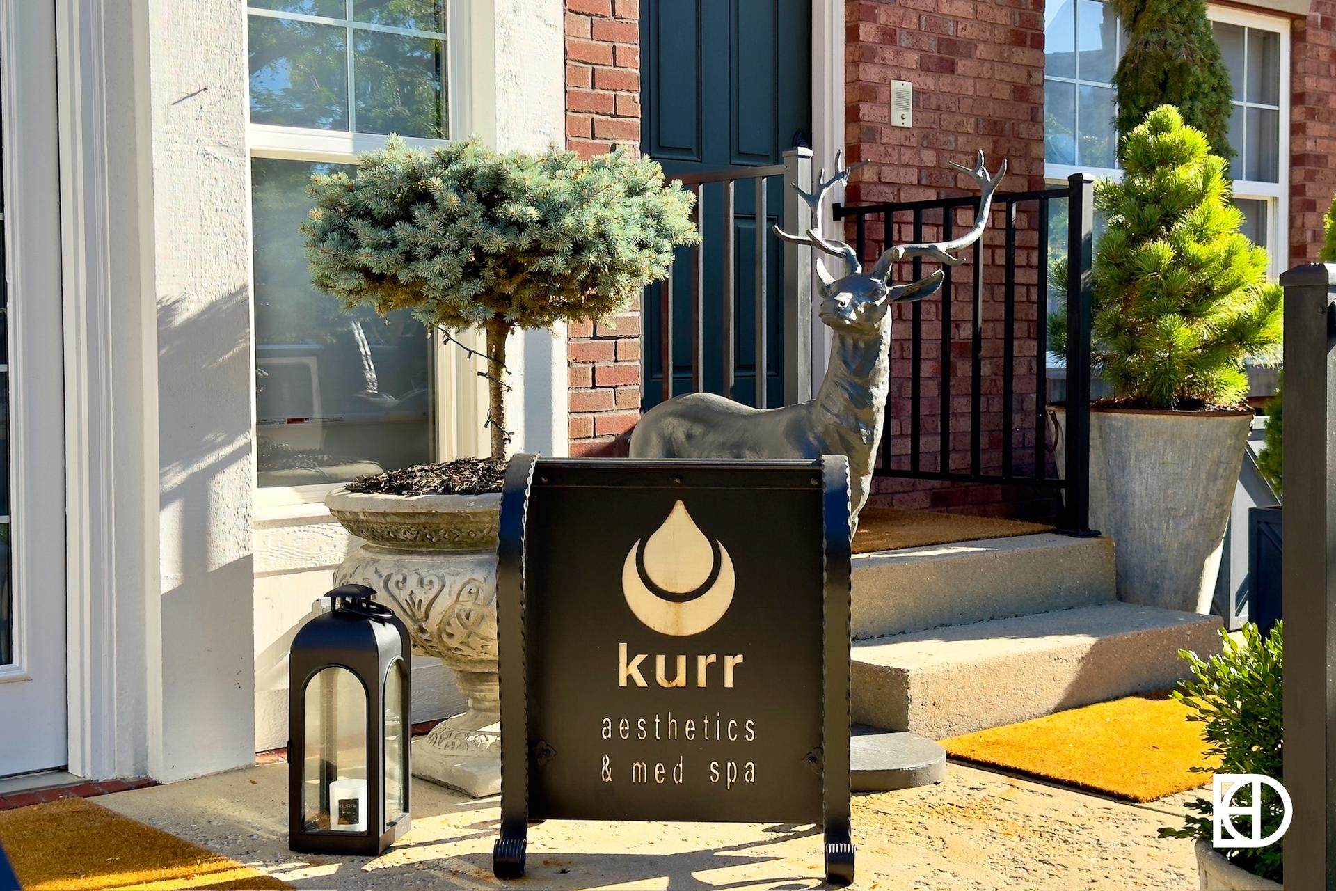 Exterior photo of Kurr Spa, showing signage and entrance