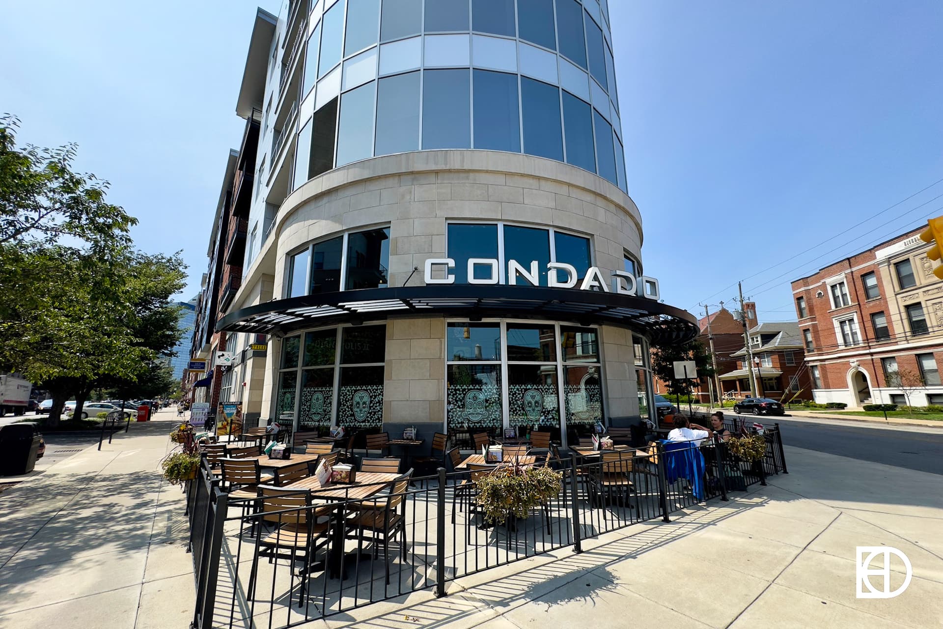 Exterior photo of Condado Tacos, showing patio and signage