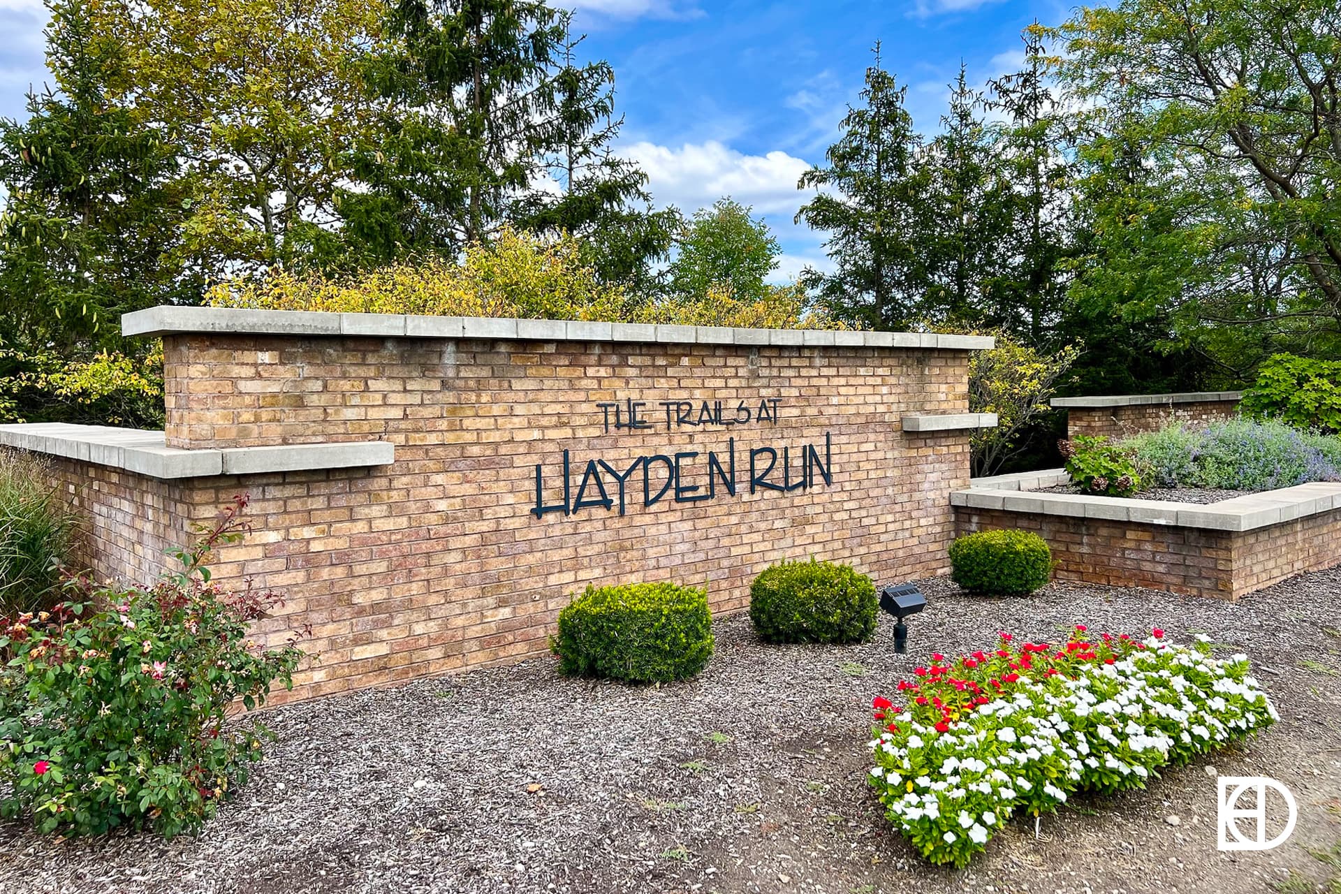 Exterior photo of The Trails at Hayden Run, showing signage