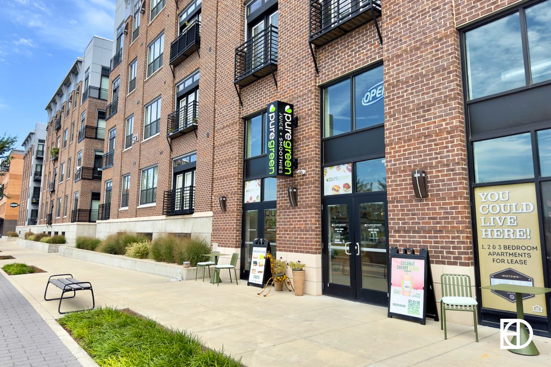 Exterior photo of Pure Green Carmel, showing entrance, signage, and decorative statue