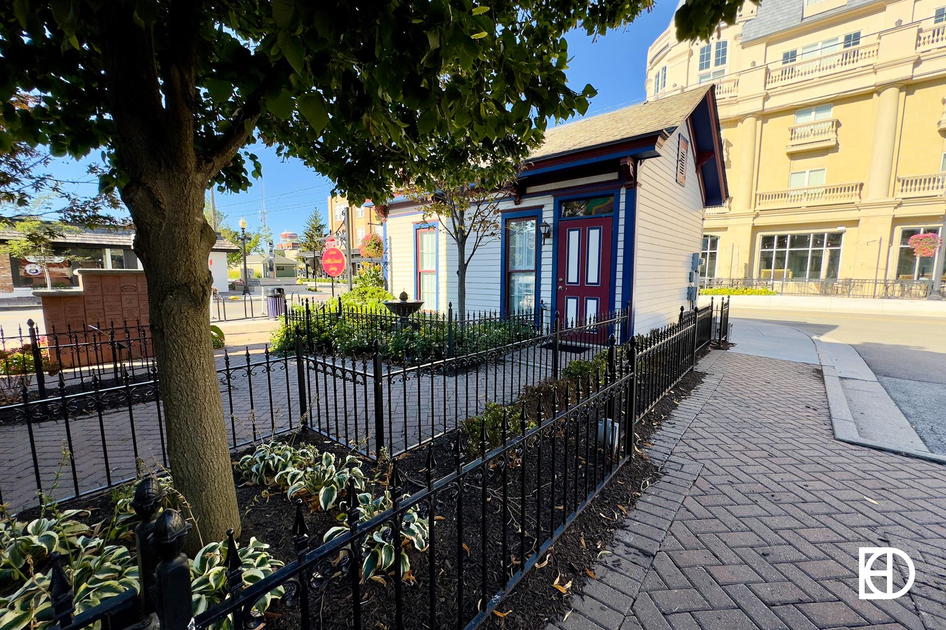 Exterior photo of Carmel Arts Council Gallery, showing landscaping and entrance