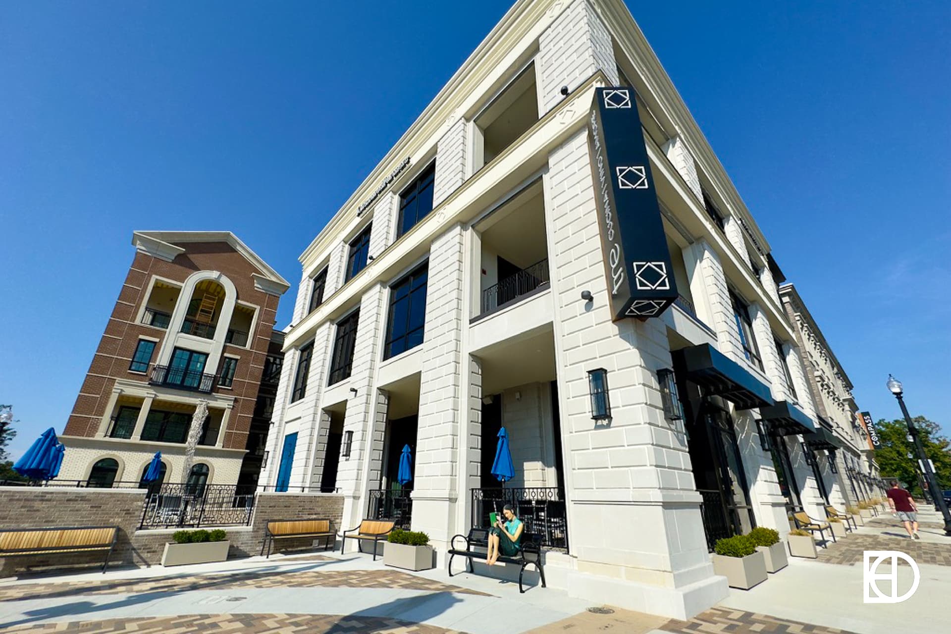 Exterior photo of Tre on Main, showing signage and patio