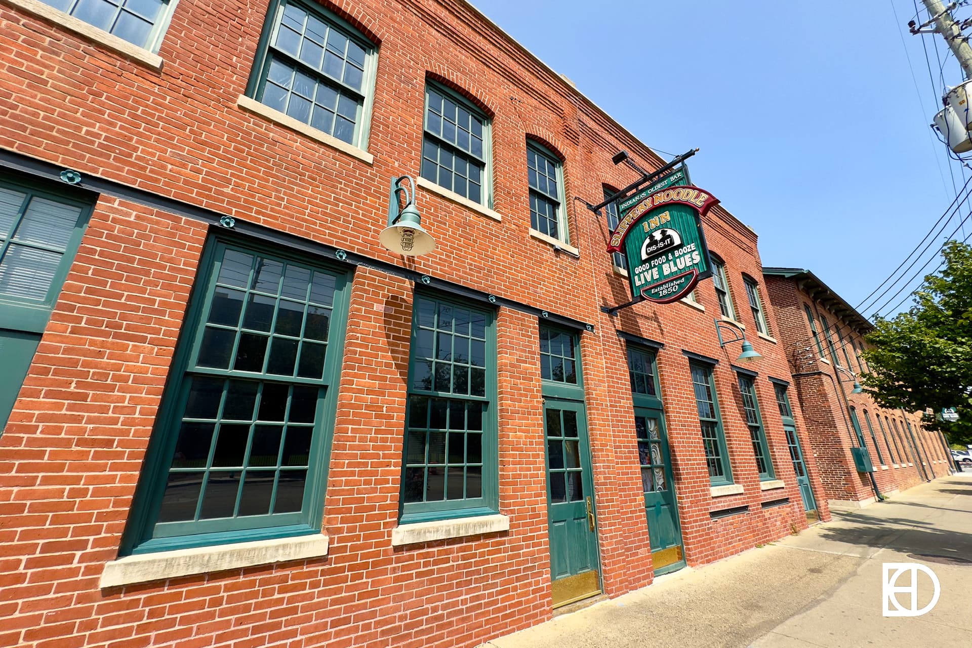 Exterior photo of Slippery Noodle Inn, showing signage, patio, and entrance