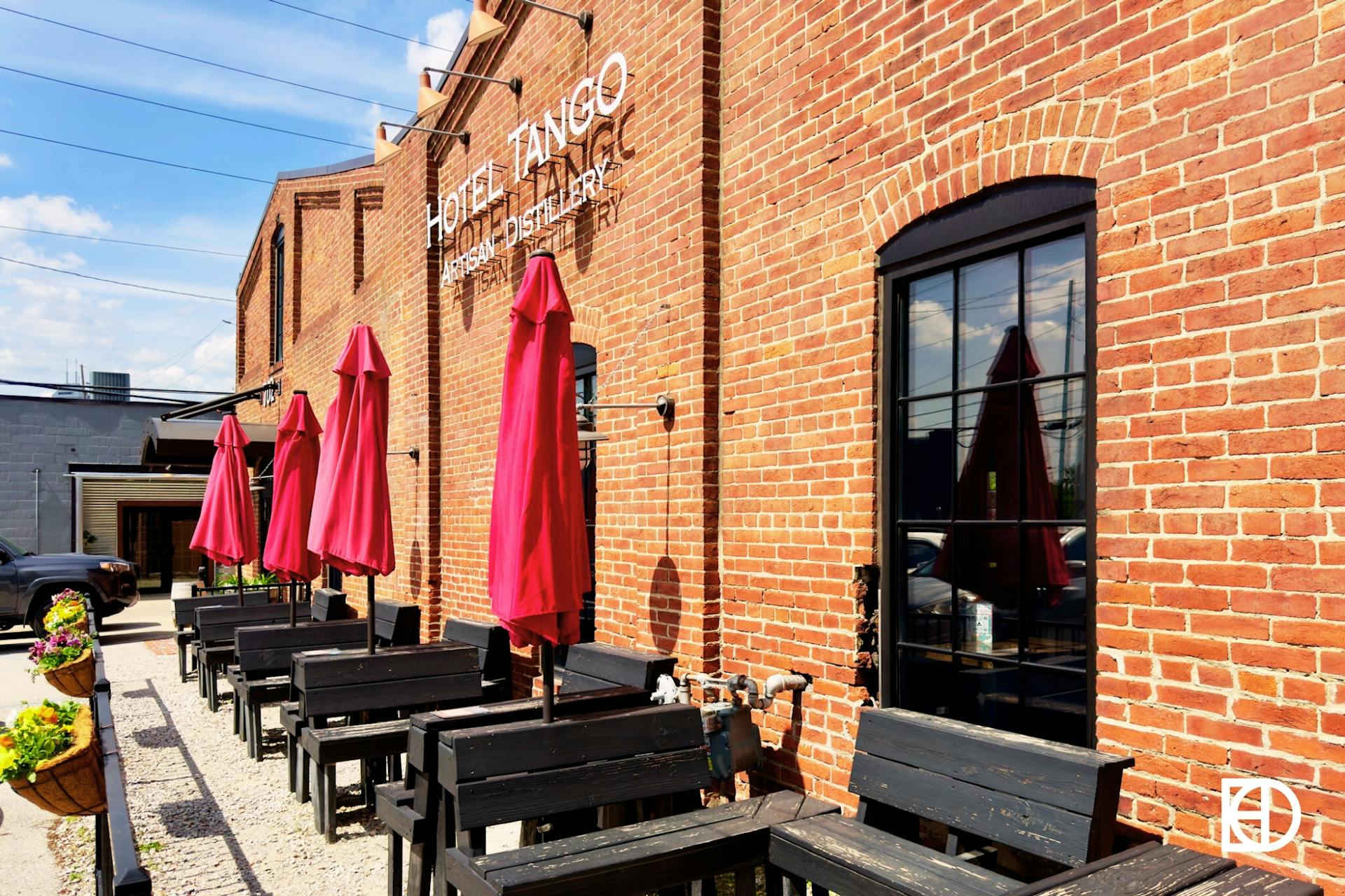 Exterior photo of Hotel Tango Distillery, showing outdoor seating