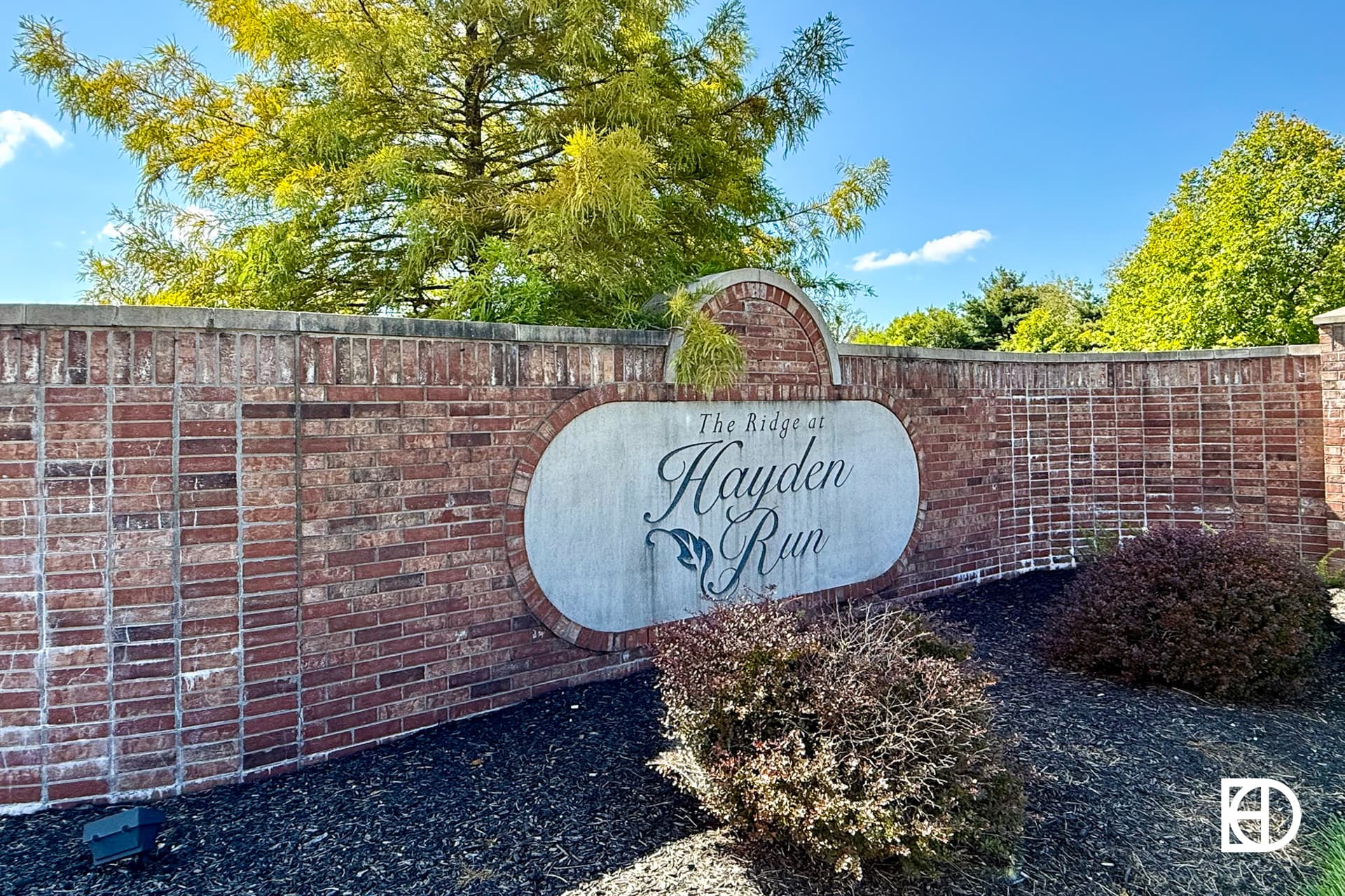 Exterior photo of Ridge at Hayden Run, showing signage and landscaping