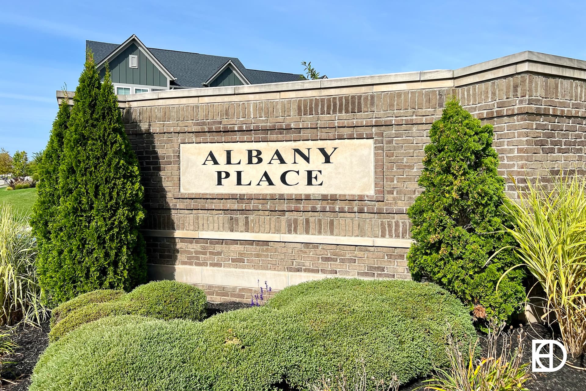 Exterior photo of Albany Place, showing signage and landscaping