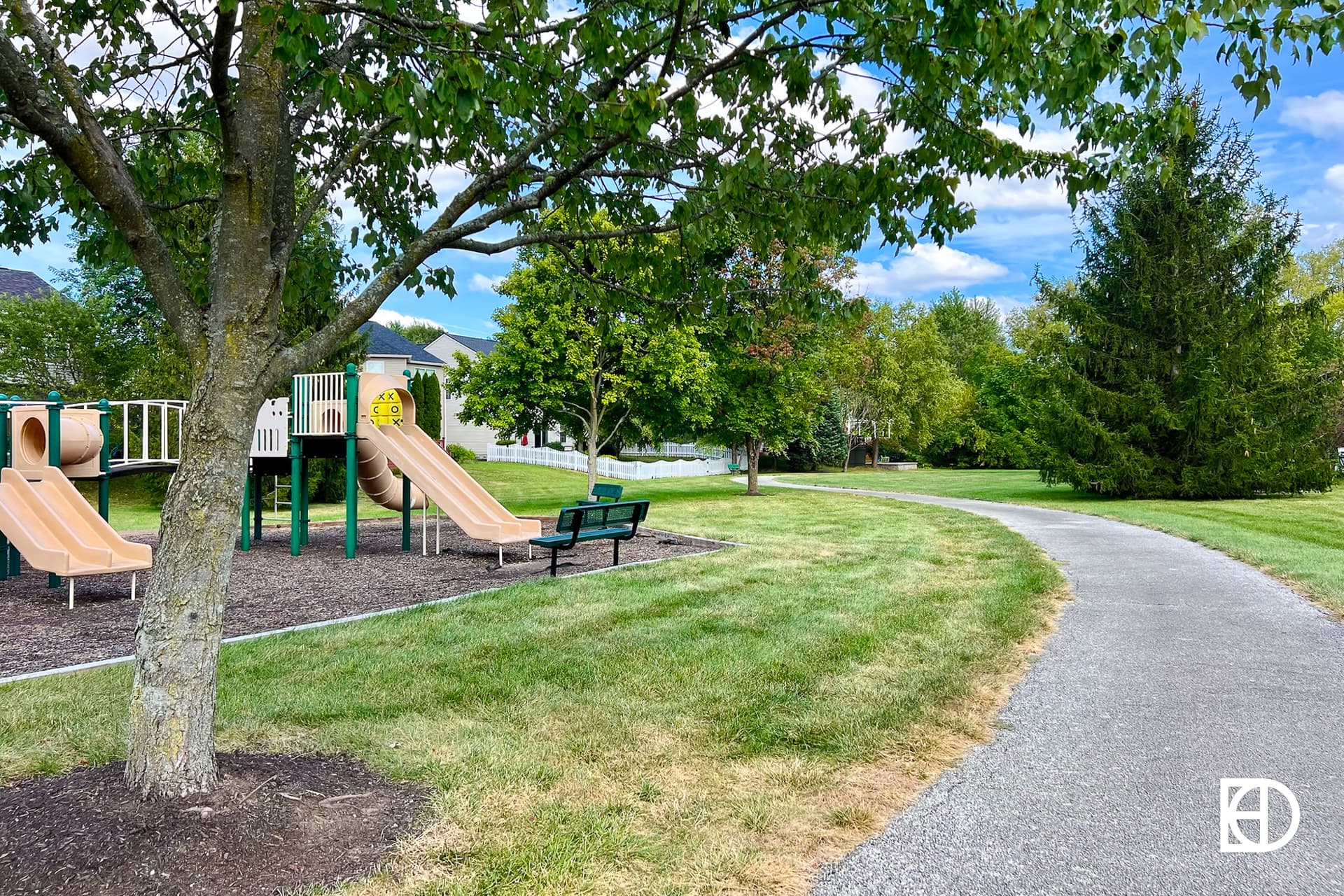 Exterior photo of Brookstone Park, showing playground and walking paths