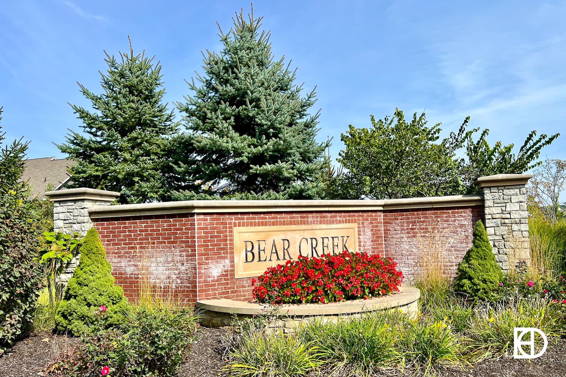 Exterior photo of Bear Creek, showing signage and walking paths