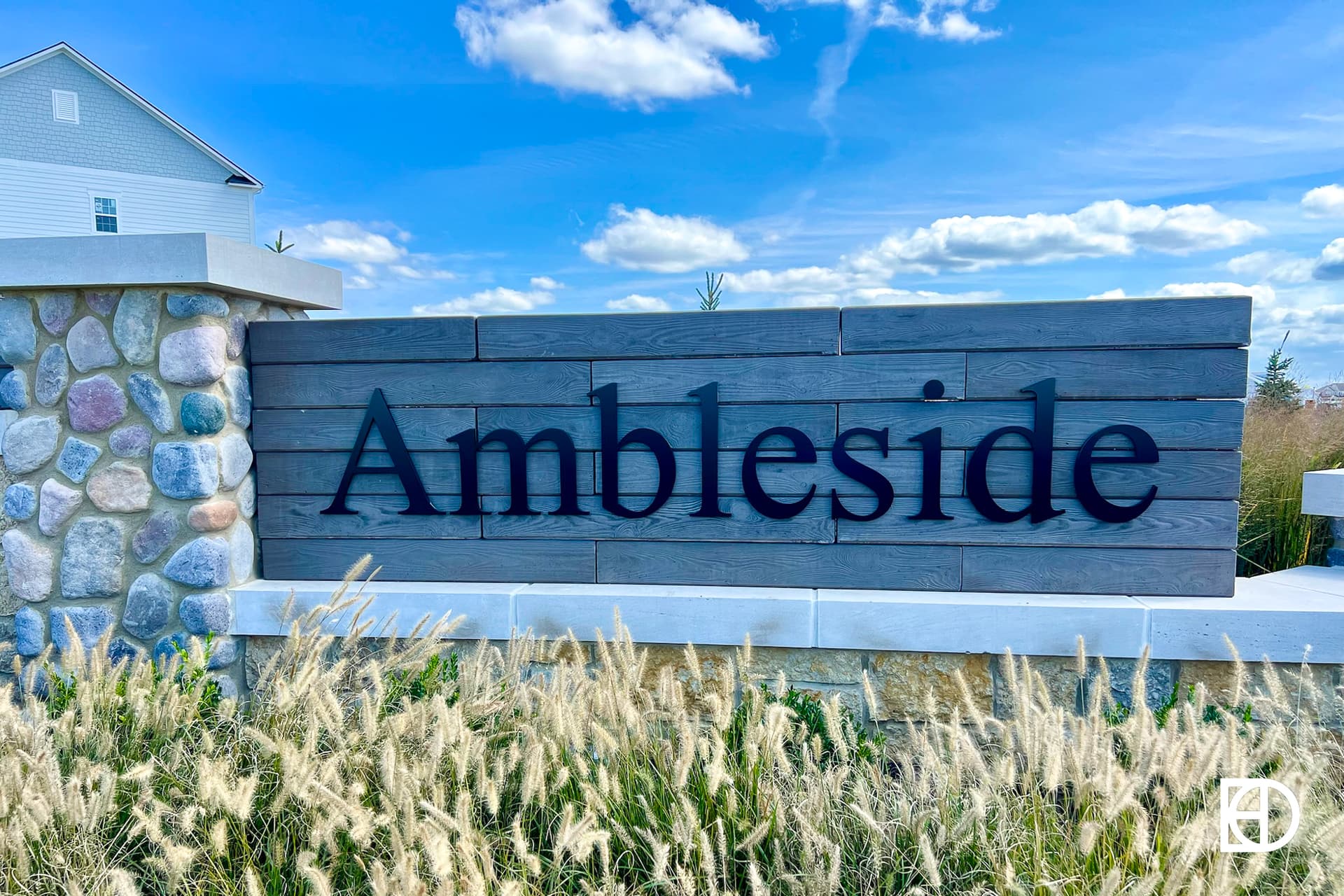 Exterior photo of Ambleside, showing signage and landscaping