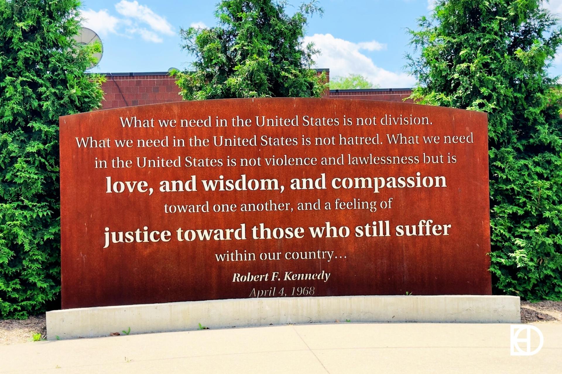 Outdoor photo of Kennedy King park, showing historical marker with quote from Robert F. Kennedy