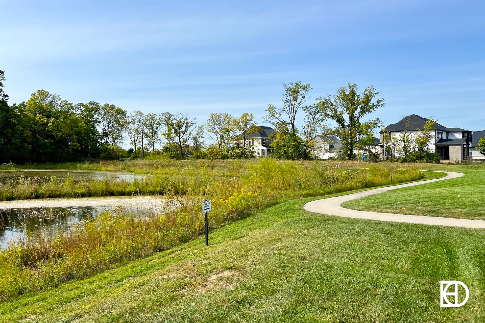 Exterior photo of Albany Place, showing walking paths and landscaping