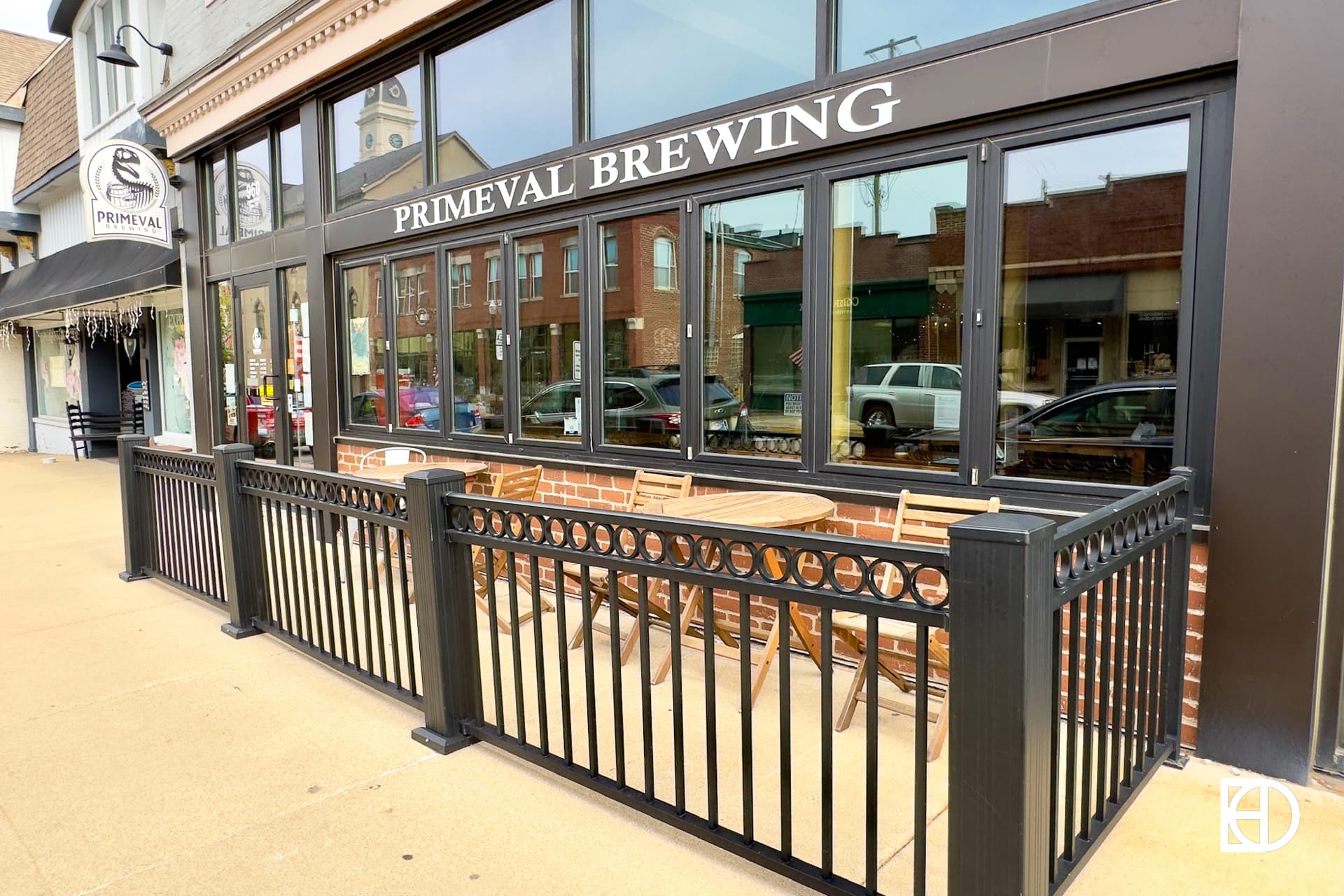 Exterior photo of Primeval Brewing, showing entrance and patio