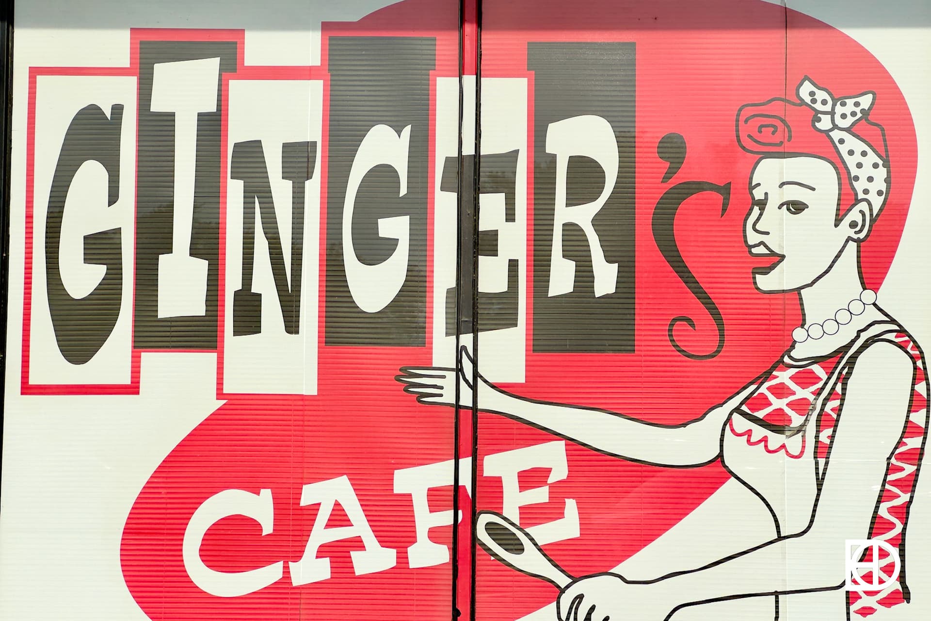 Exterior photo of Ginger's Cafe, showing signage