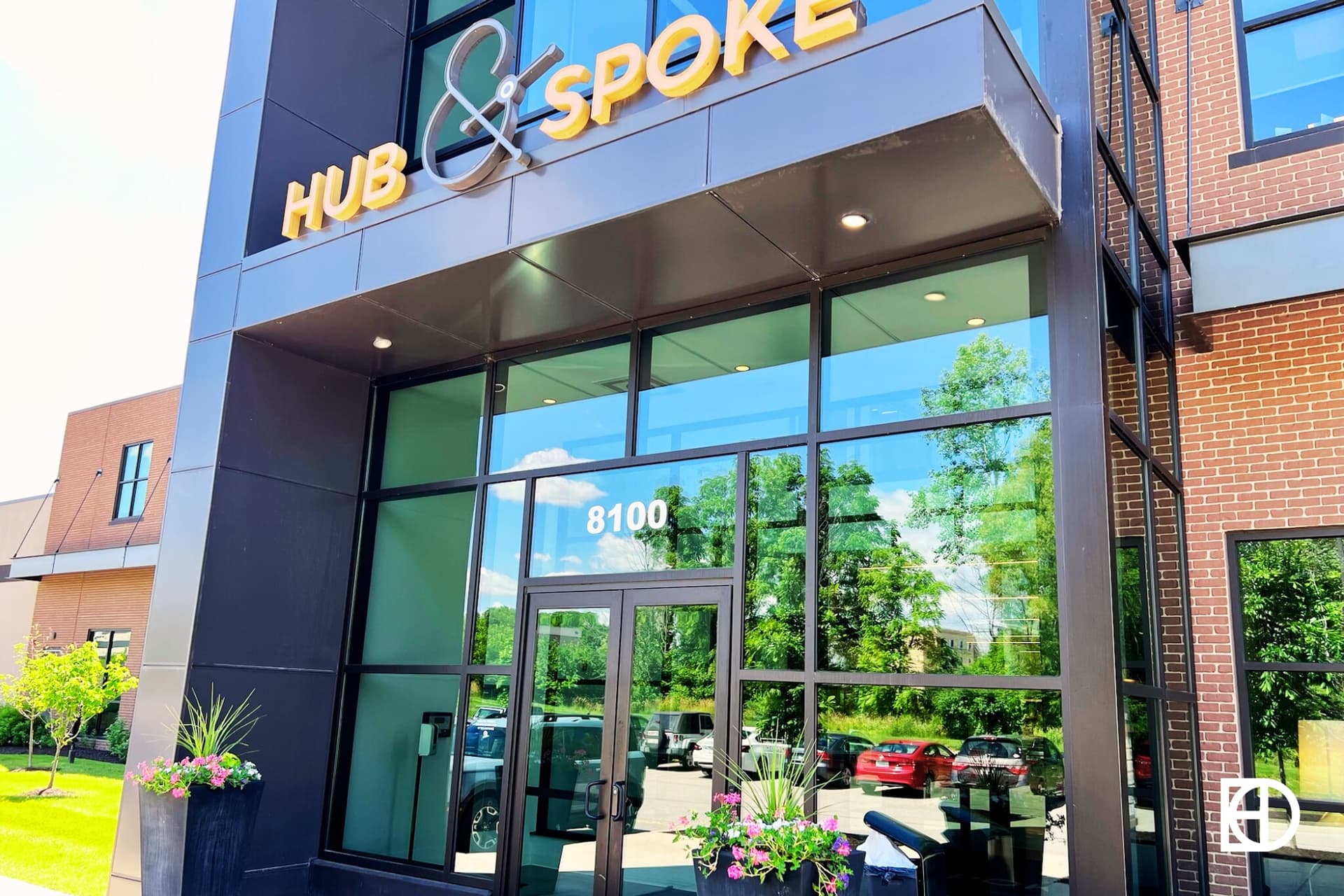 Exterior photo of Hub & Spoke, showing signage and entrance