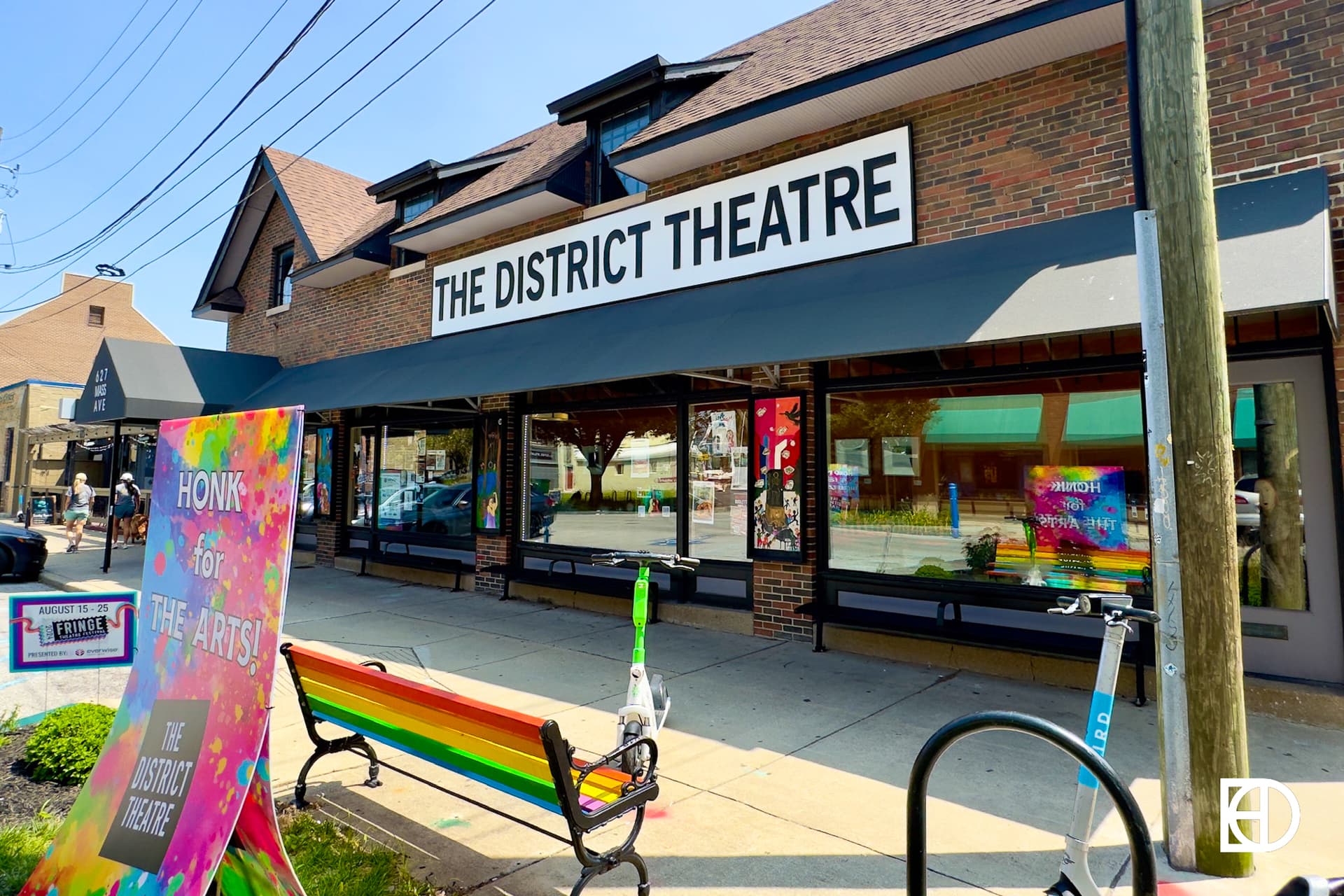 Exterior photo of The District Theatre, showing signage and entrance