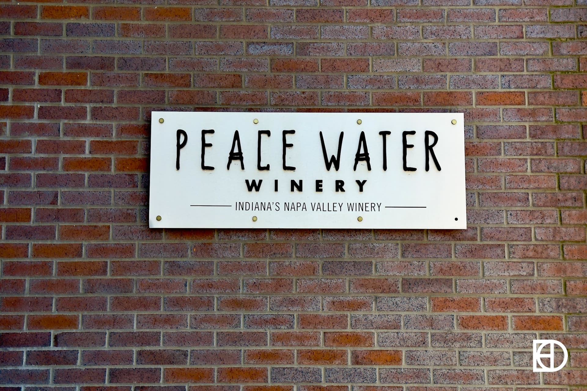 Exterior photo of Peace Water Winery, showing signage