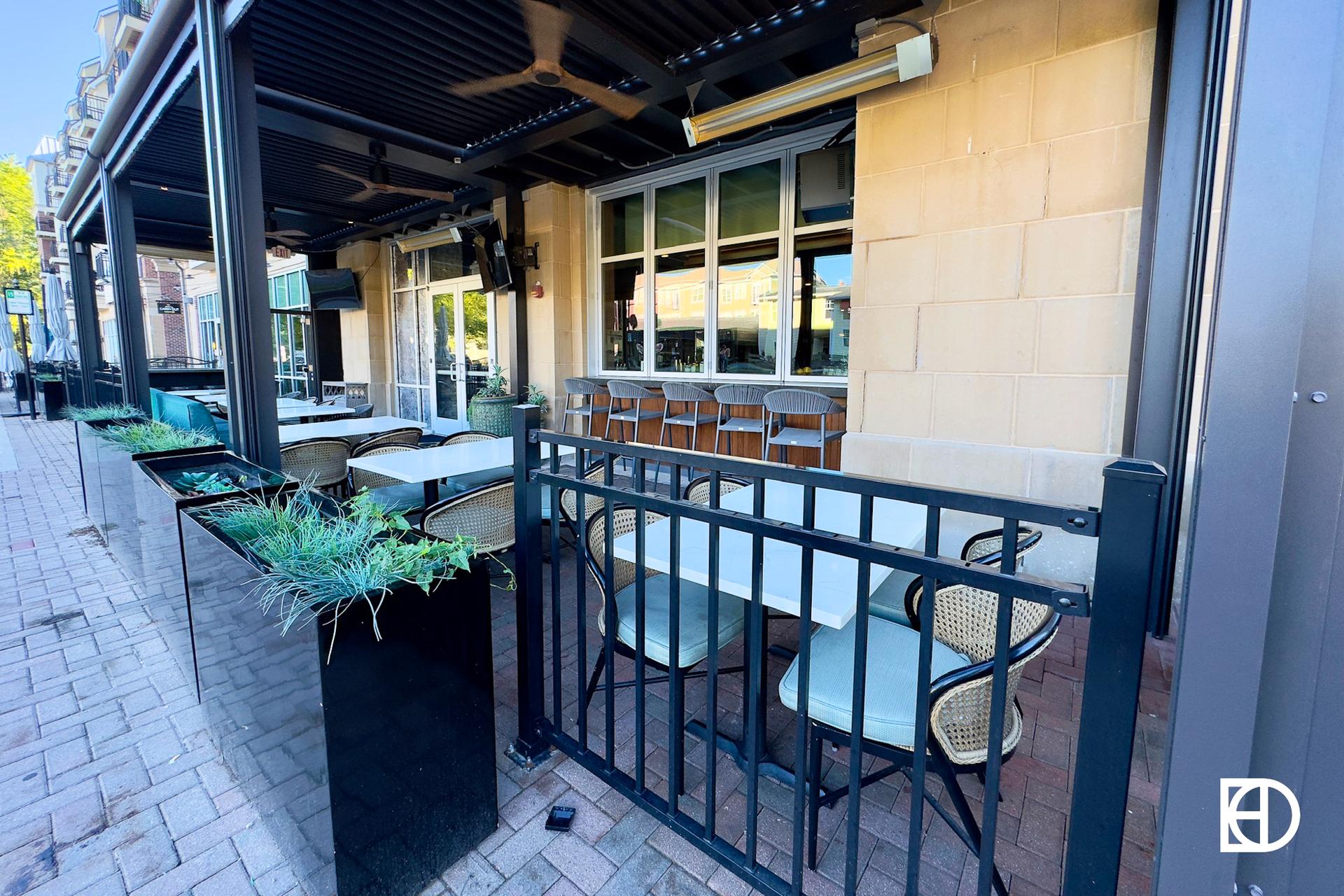 Exterior photo of Monterey Coastal Kitchen, showing patio and entrance