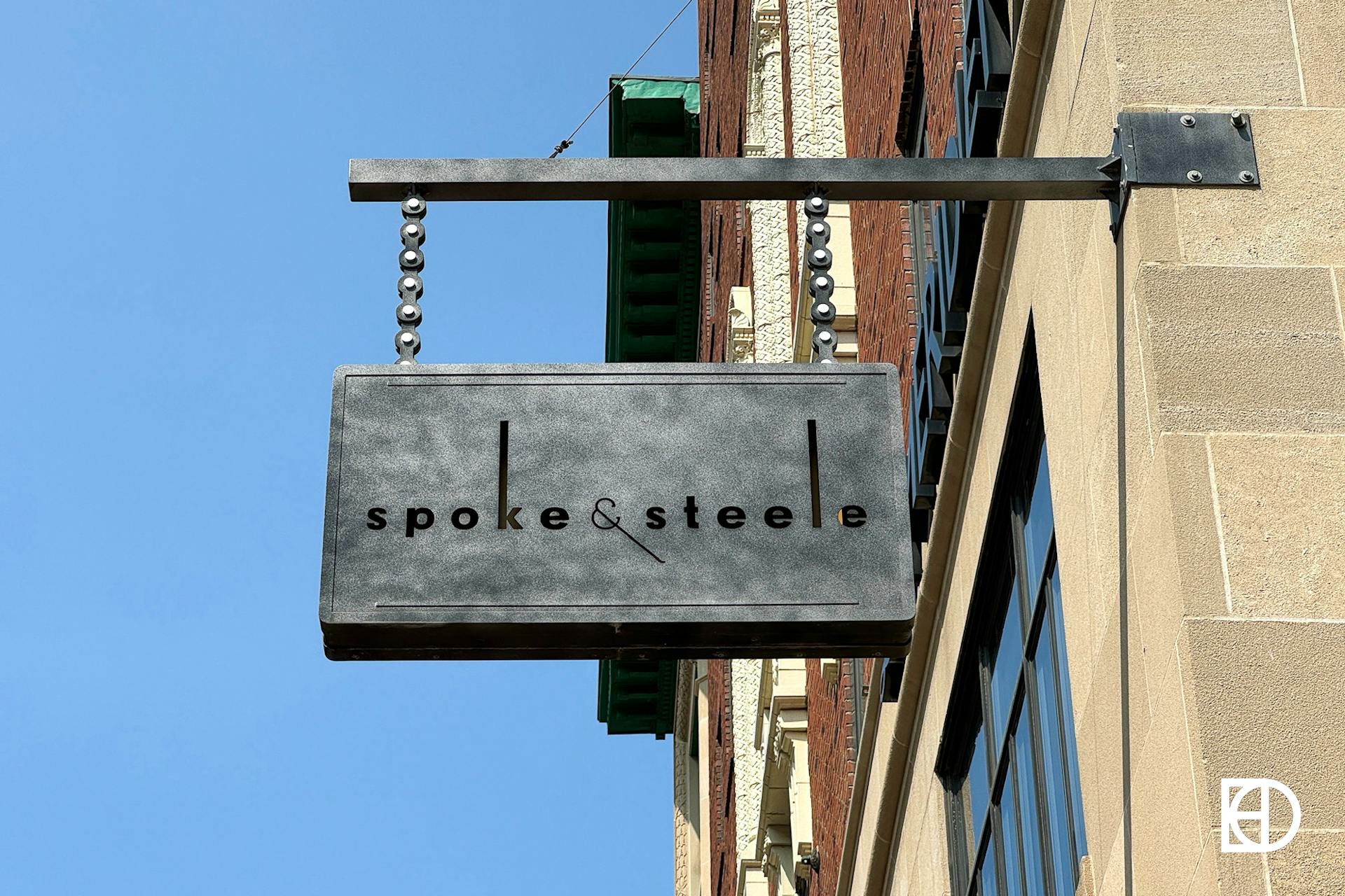 Exterior photo of Spoke & Steele, showing signage