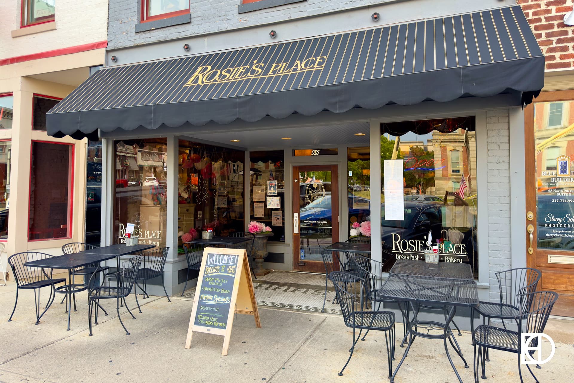 Exterior photo of Rosie's Place, showing signage and patio