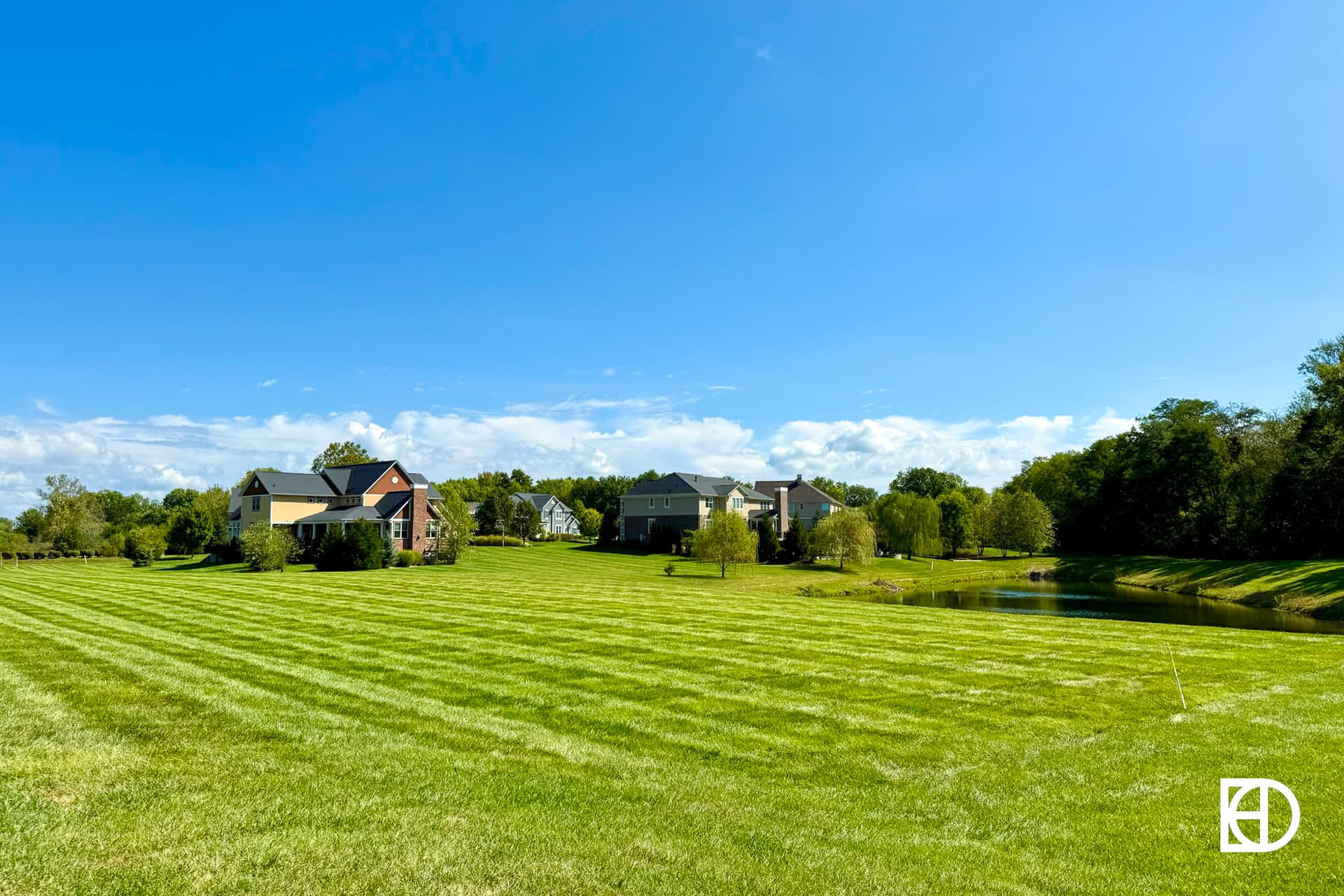 Exterior photo of Woods at Lion Creek, showing open space and landscaping