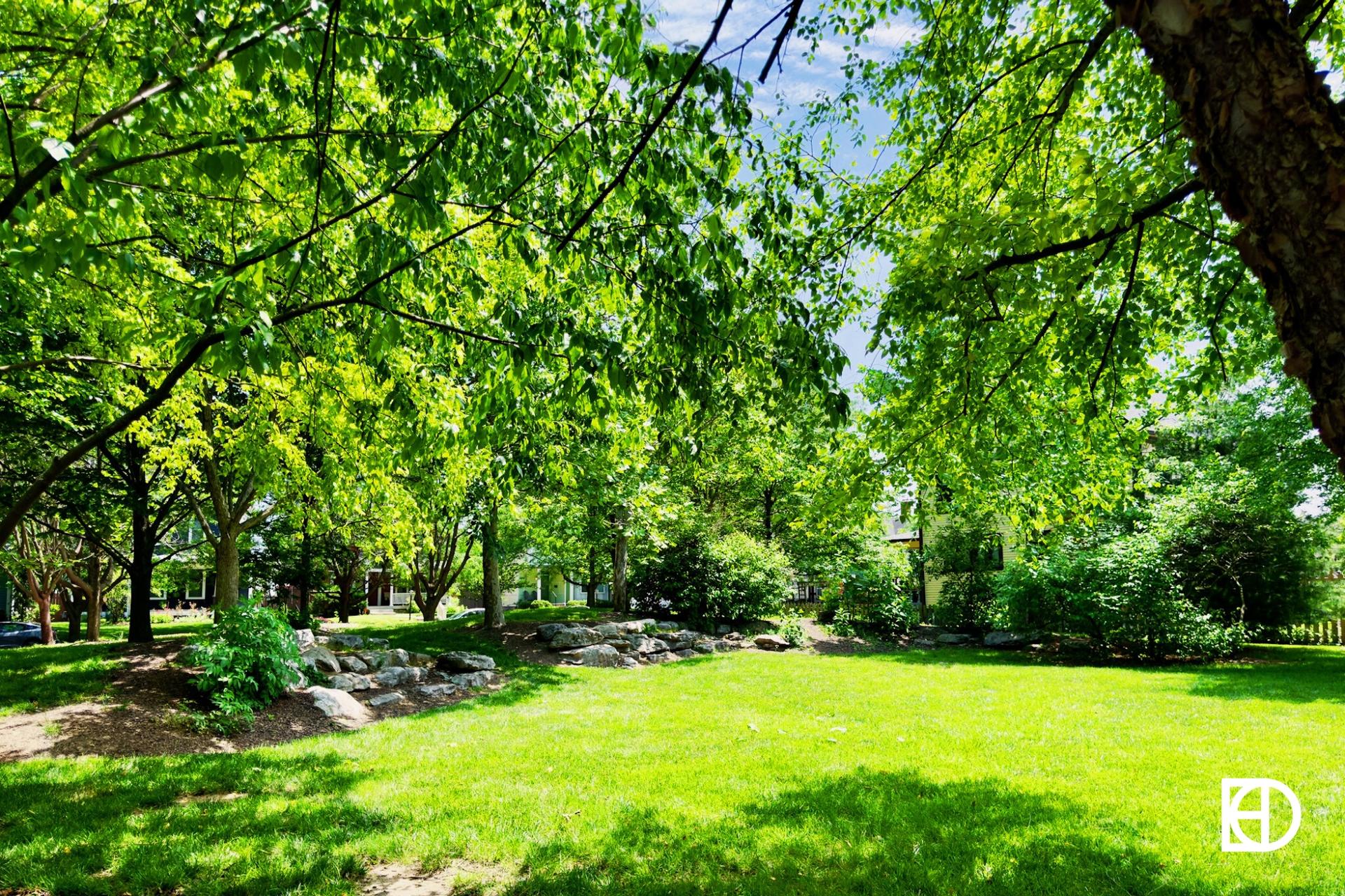 Exterior photo of Fall Creek Arboretum, showing green space and trees