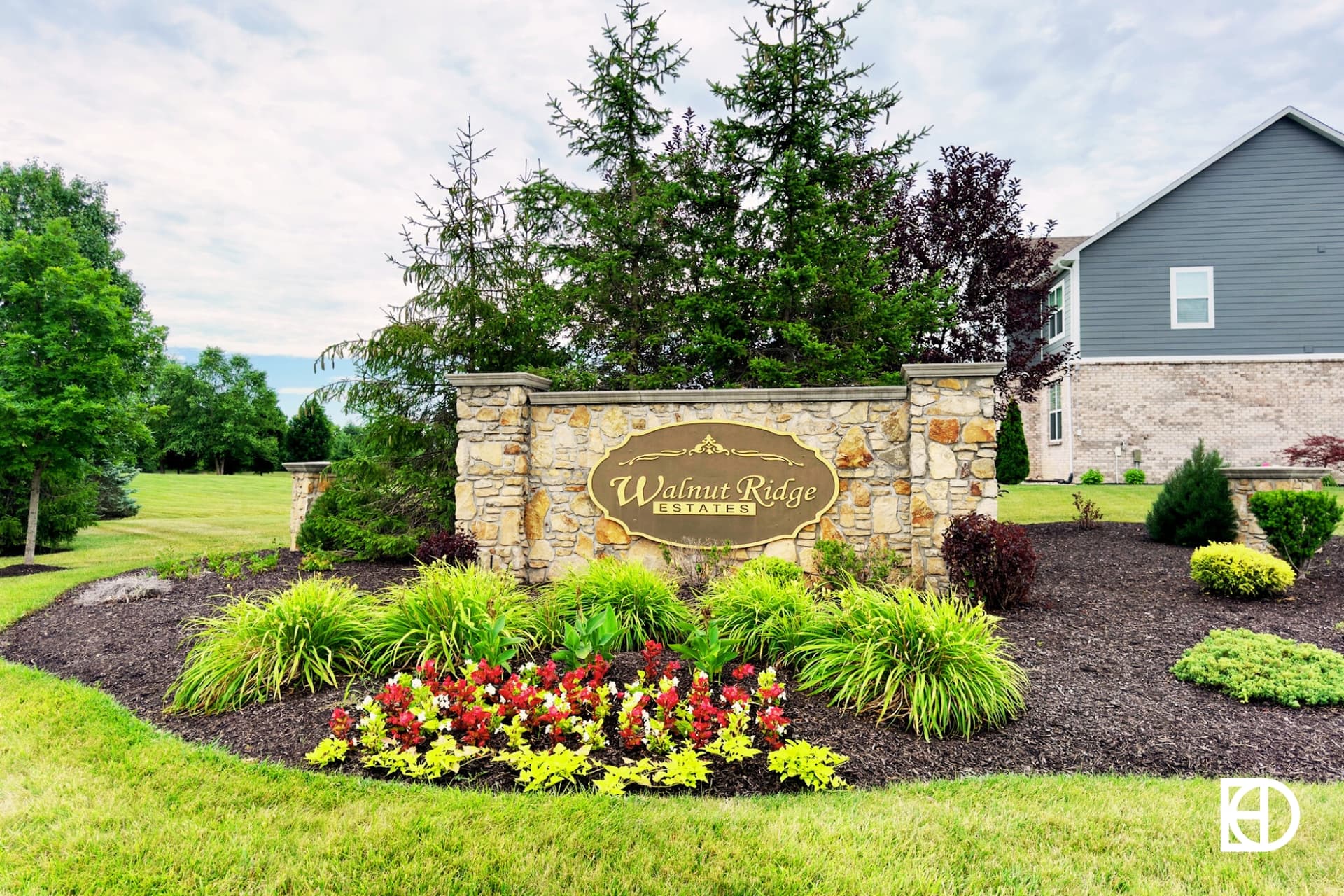 Exterior photo of Walnut Ridge Estates, showing signage and landscaping