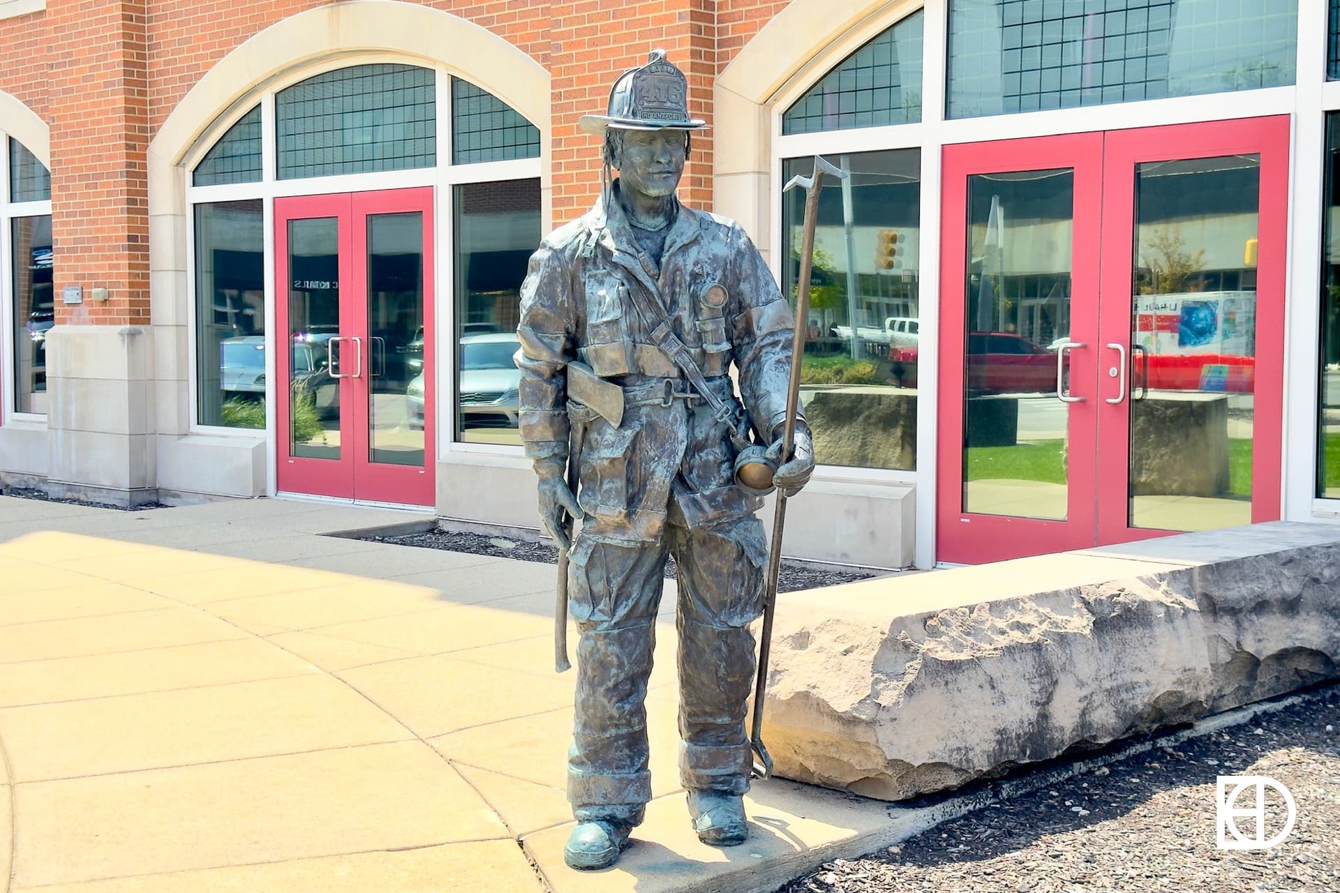 Exterior photo of Firefighters Museum, showing statue