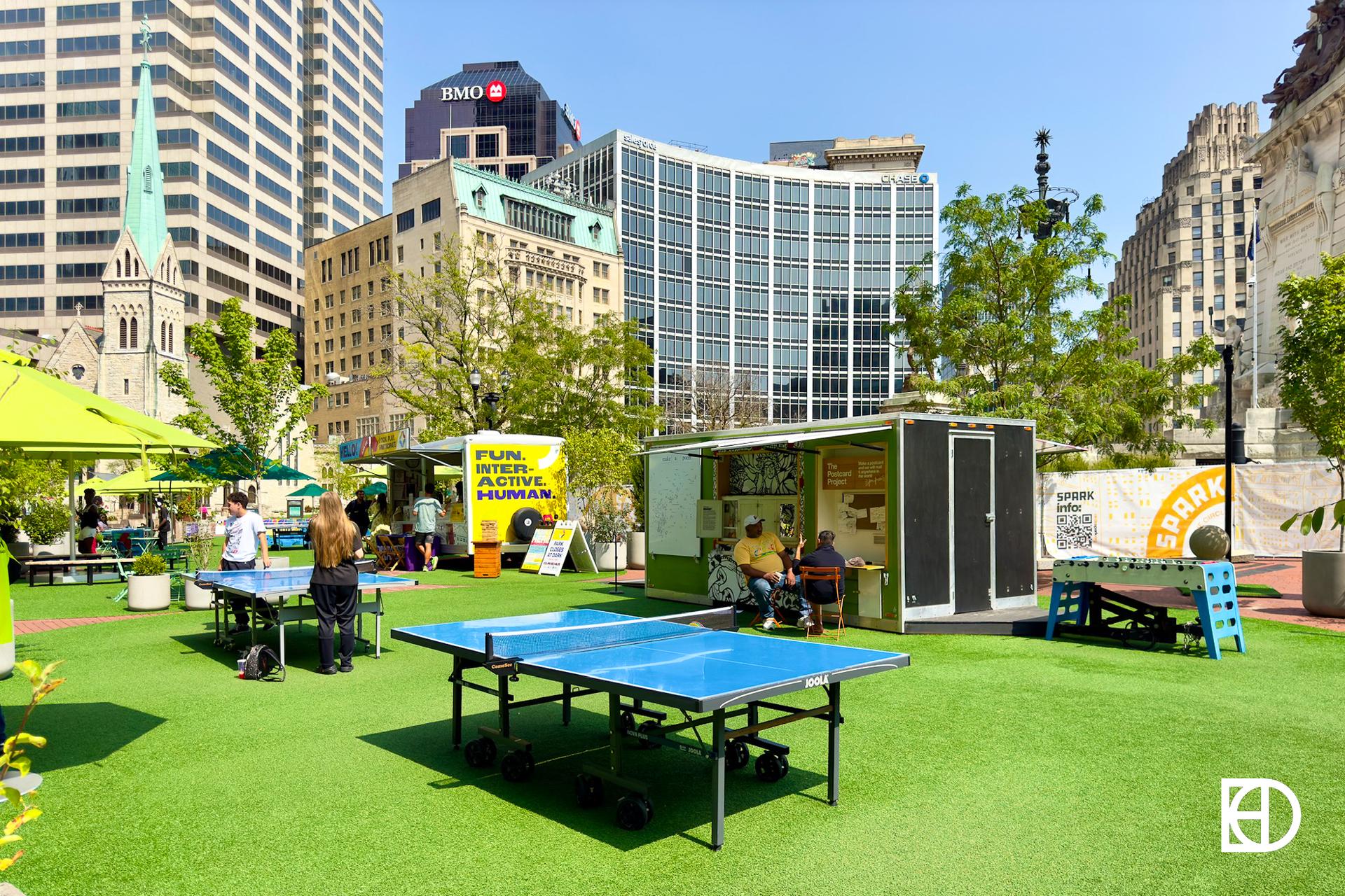 Exterior photo of Monument Circle, showing Spark Park recreational activities