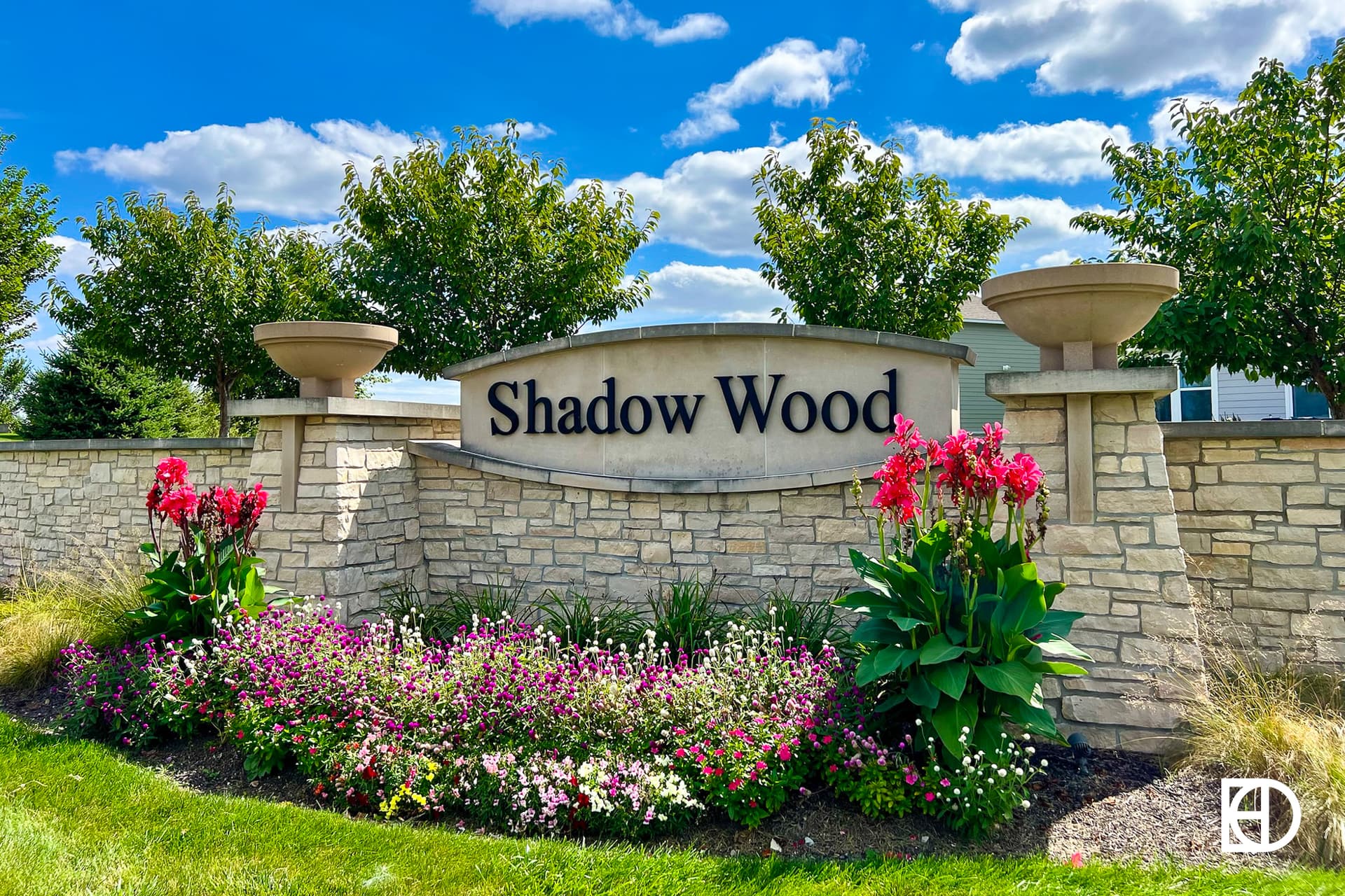 Exterior photo of Shadow Wood, showing signage and landscaping